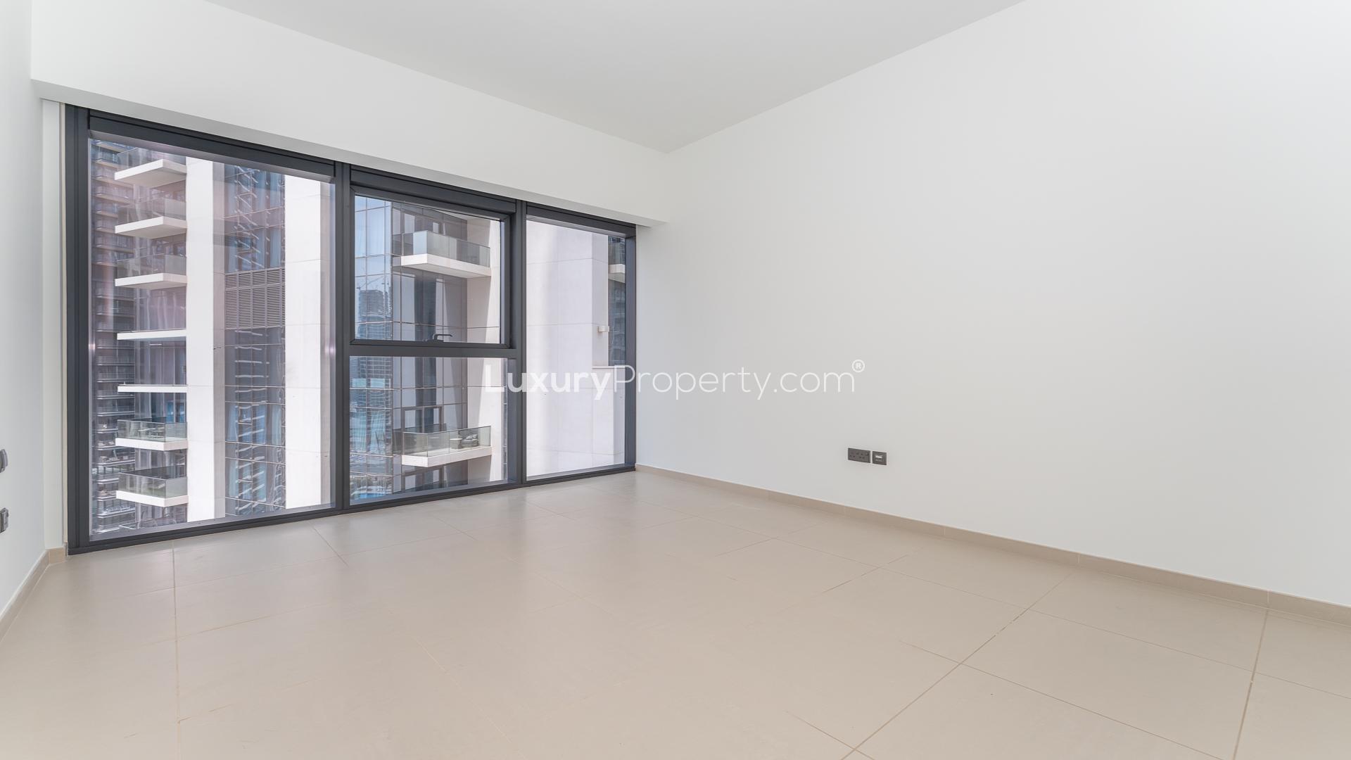 Modern open-plan living area in Act Towers apartment, Downtown Dubai, available for rent