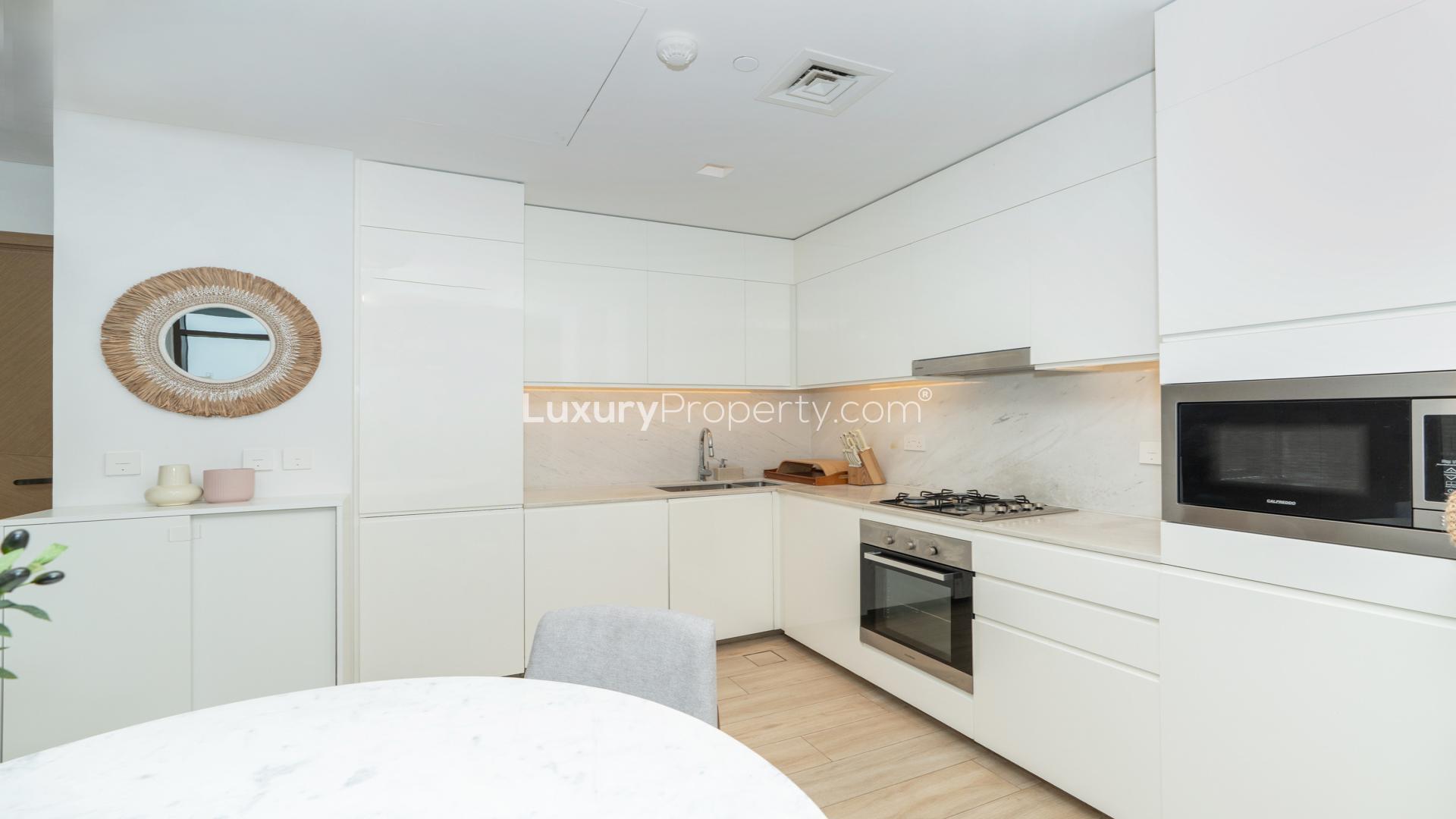 Modern living room and kitchen in Dubai Creek Harbour Palace Residences apartment for rent