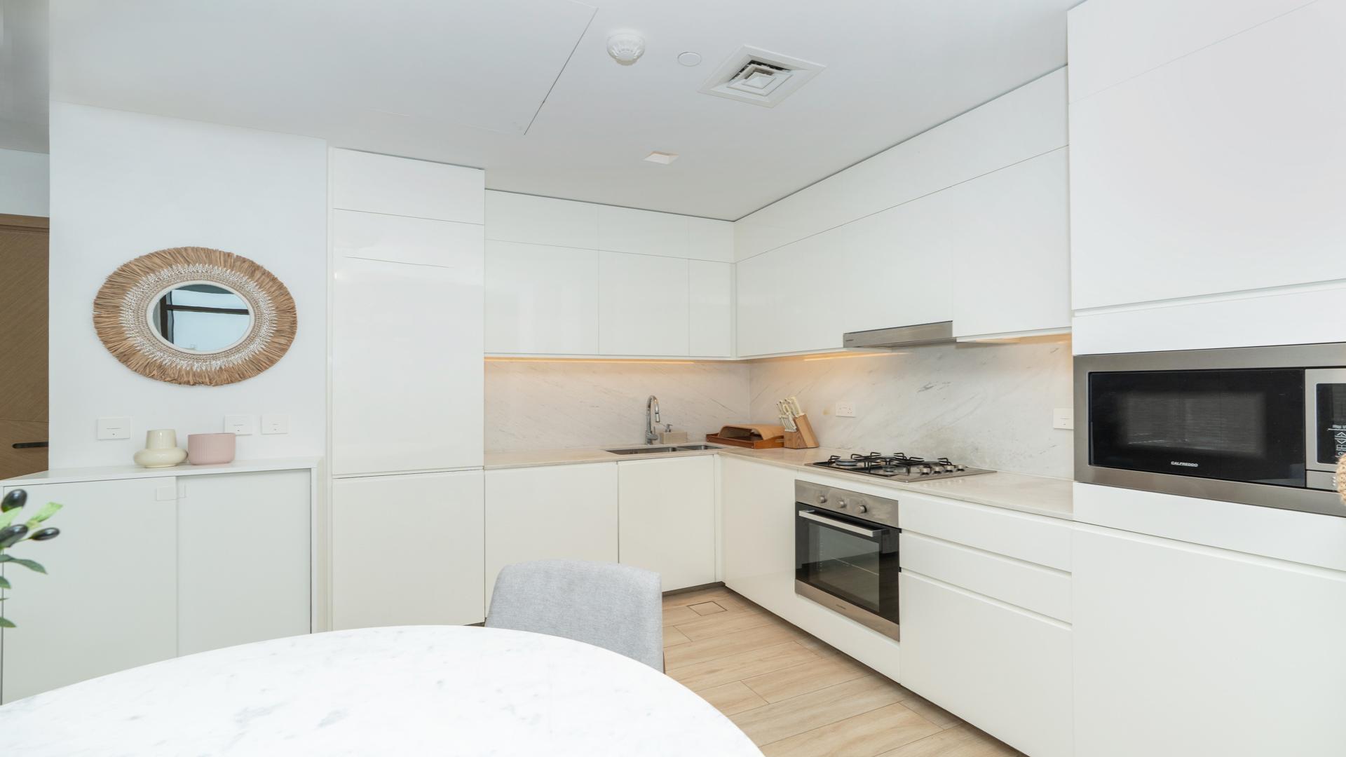 Modern living room and kitchen in Dubai Creek Harbour Palace Residences apartment for rent