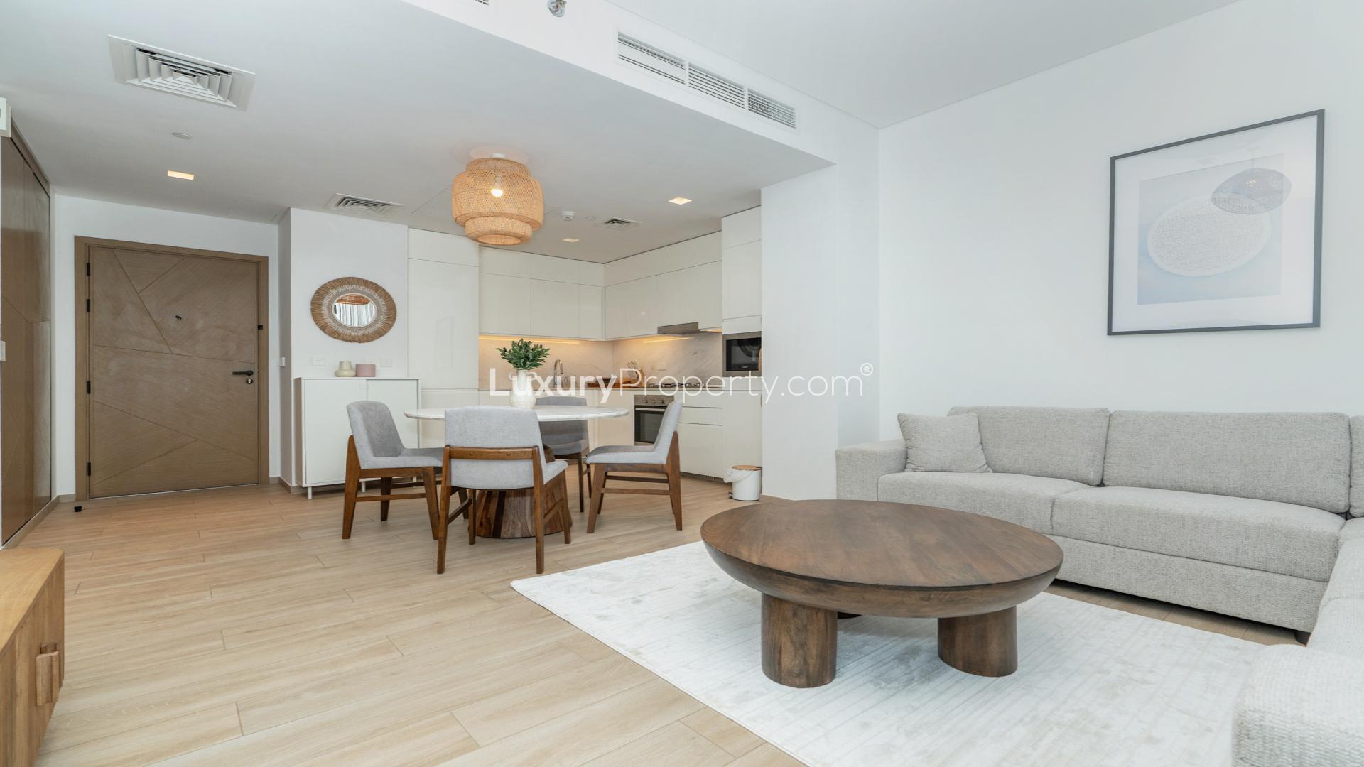 Modern open-plan kitchen and living area in Dubai Creek Harbour apartment, Palace Residences