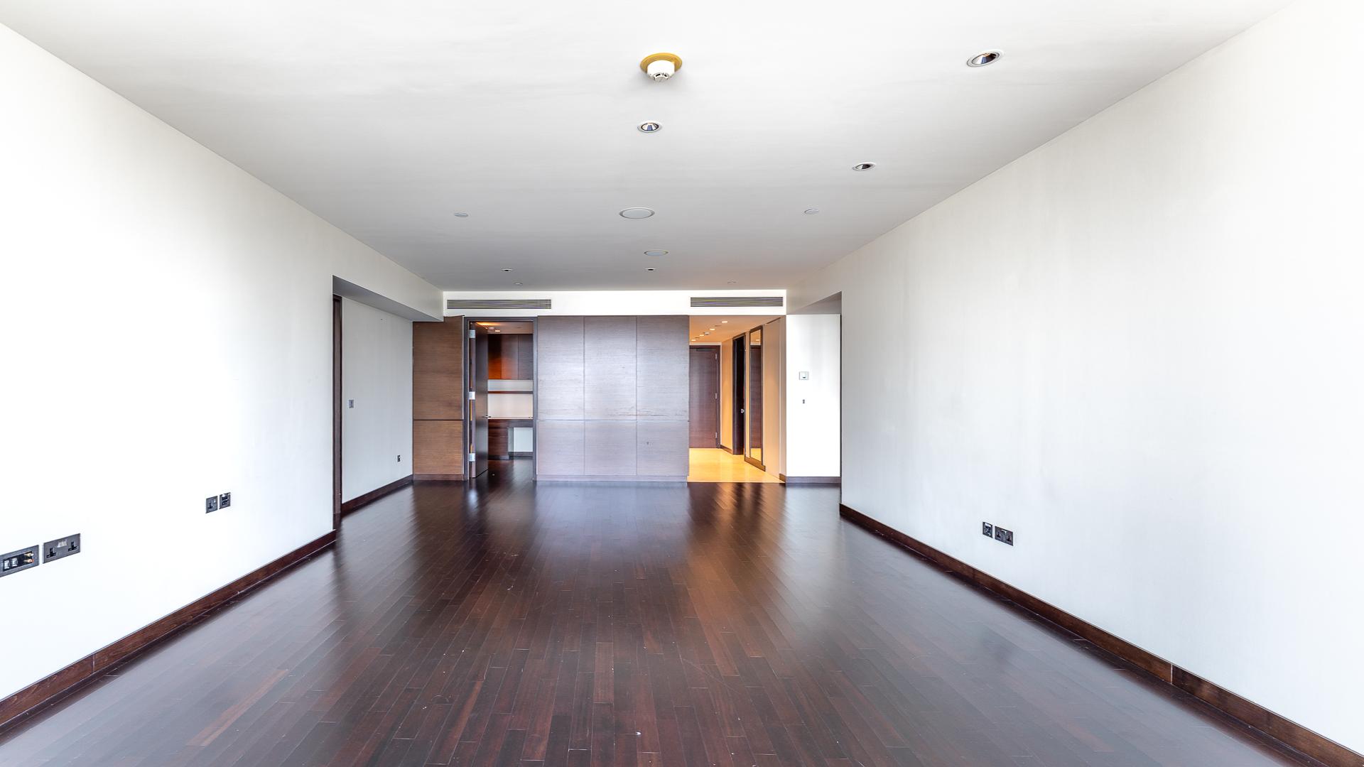 Empty living room with city skyline view in Burj Khalifa apartment for rent