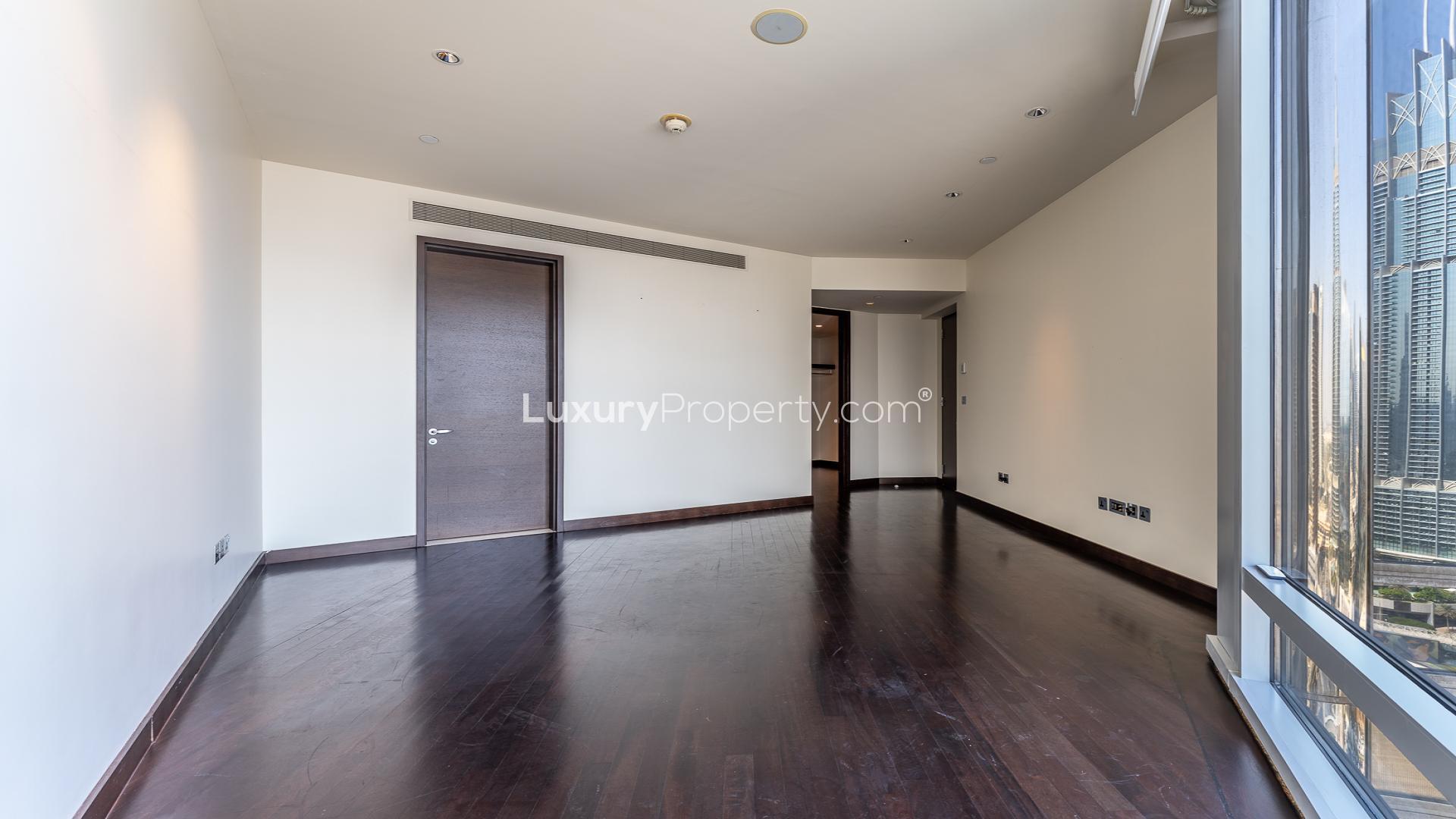 Spacious living area in Burj Khalifa apartment with modern wood flooring, prime rental location