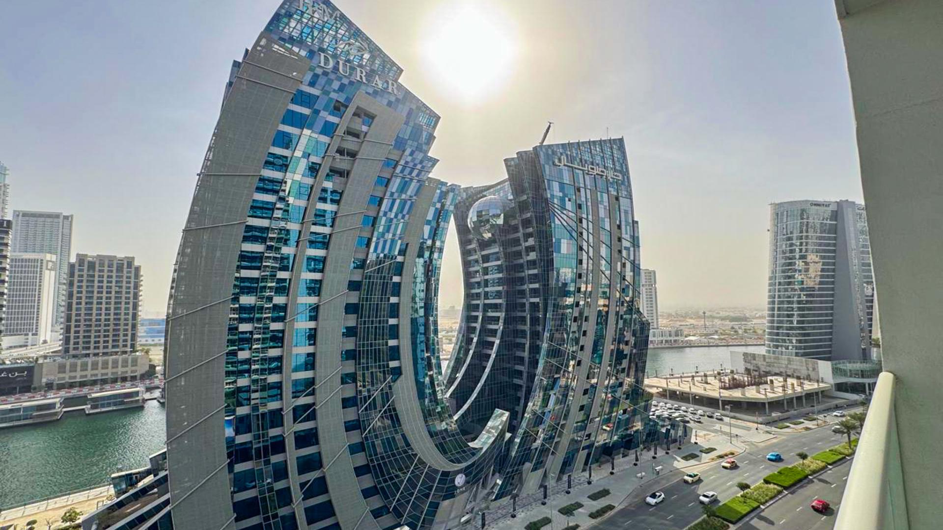 Modern bedroom with city view, Binghatti Skyrise apartment, Business Bay, available for rent