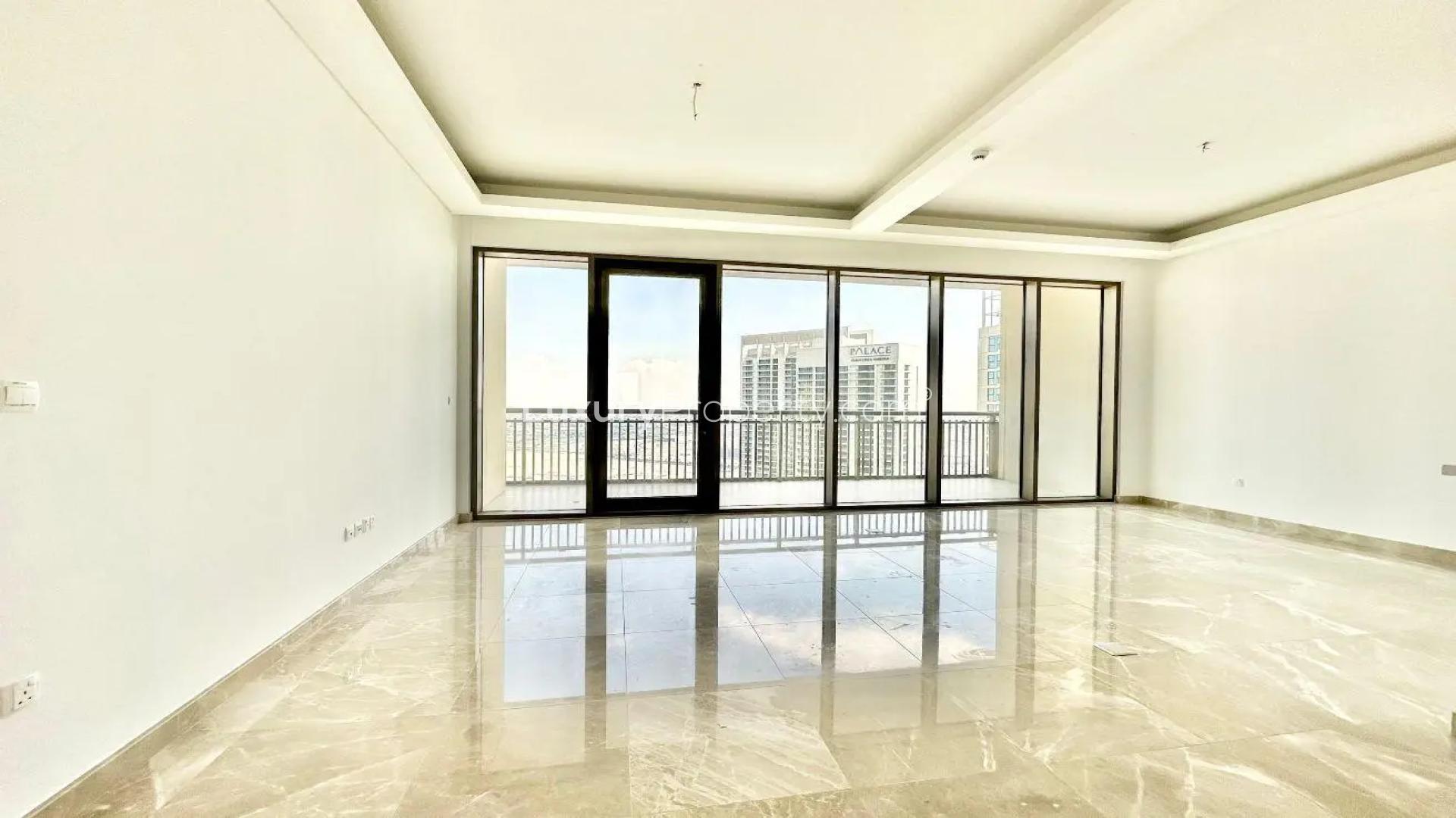 Spacious living area with floor-to-ceiling windows in Dubai Creek Harbour penthouse