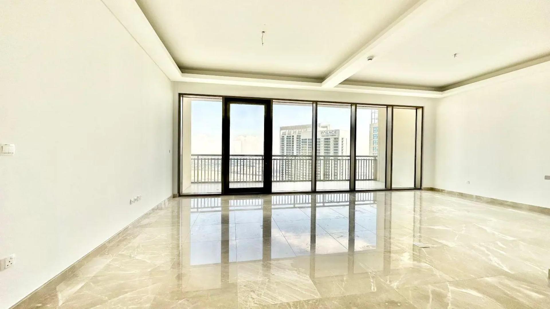 Spacious living area with floor-to-ceiling windows in Dubai Creek Harbour penthouse