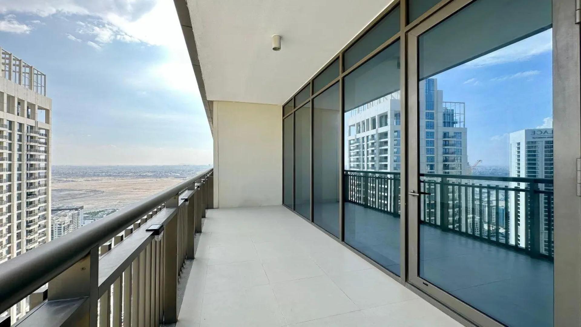 Luxurious high-floor penthouse living room with large windows in Dubai Creek Harbour