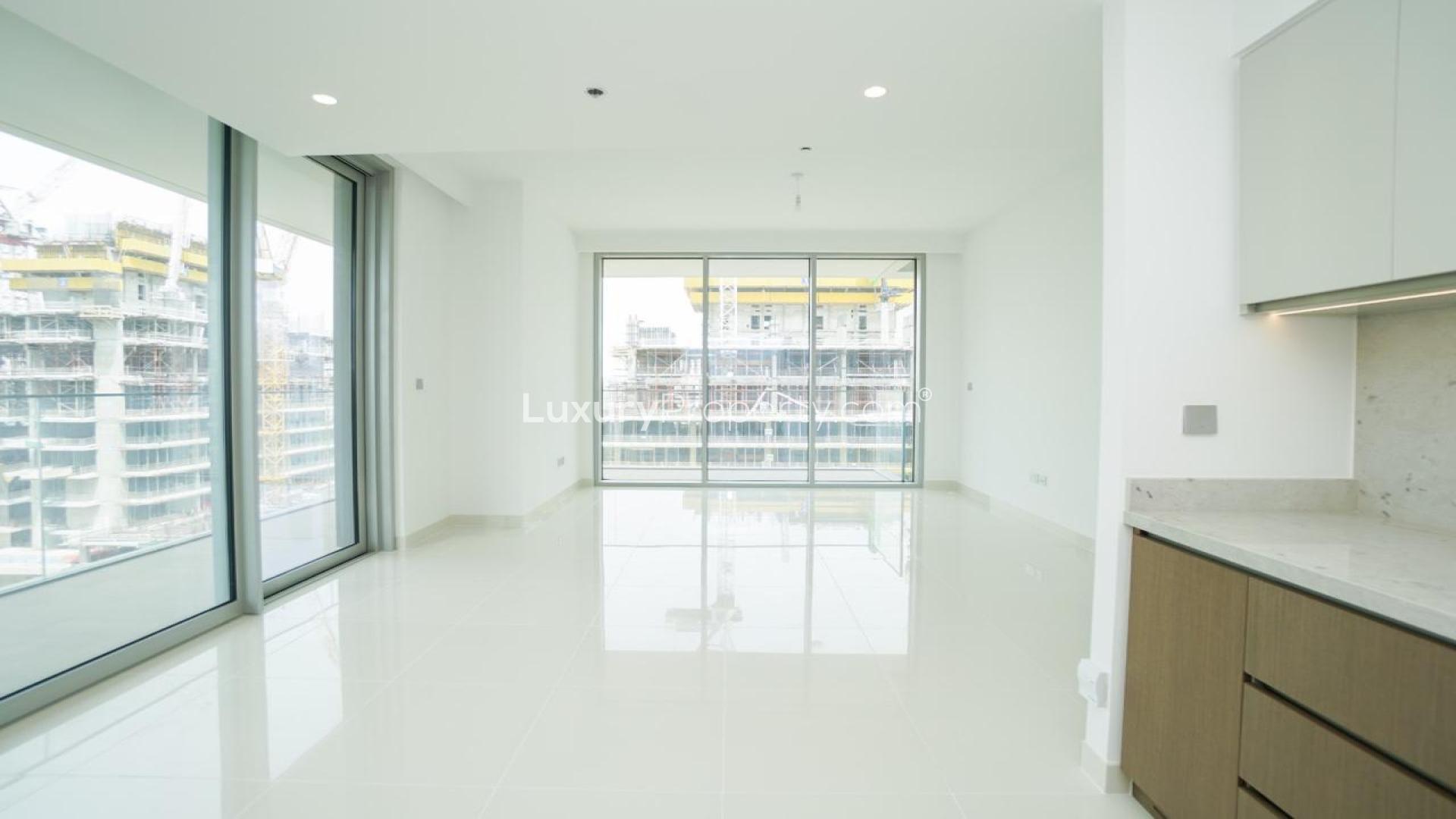 Modern kitchen and living area in Emaar Beachfront Beach Isle Tower 2 apartment for rent