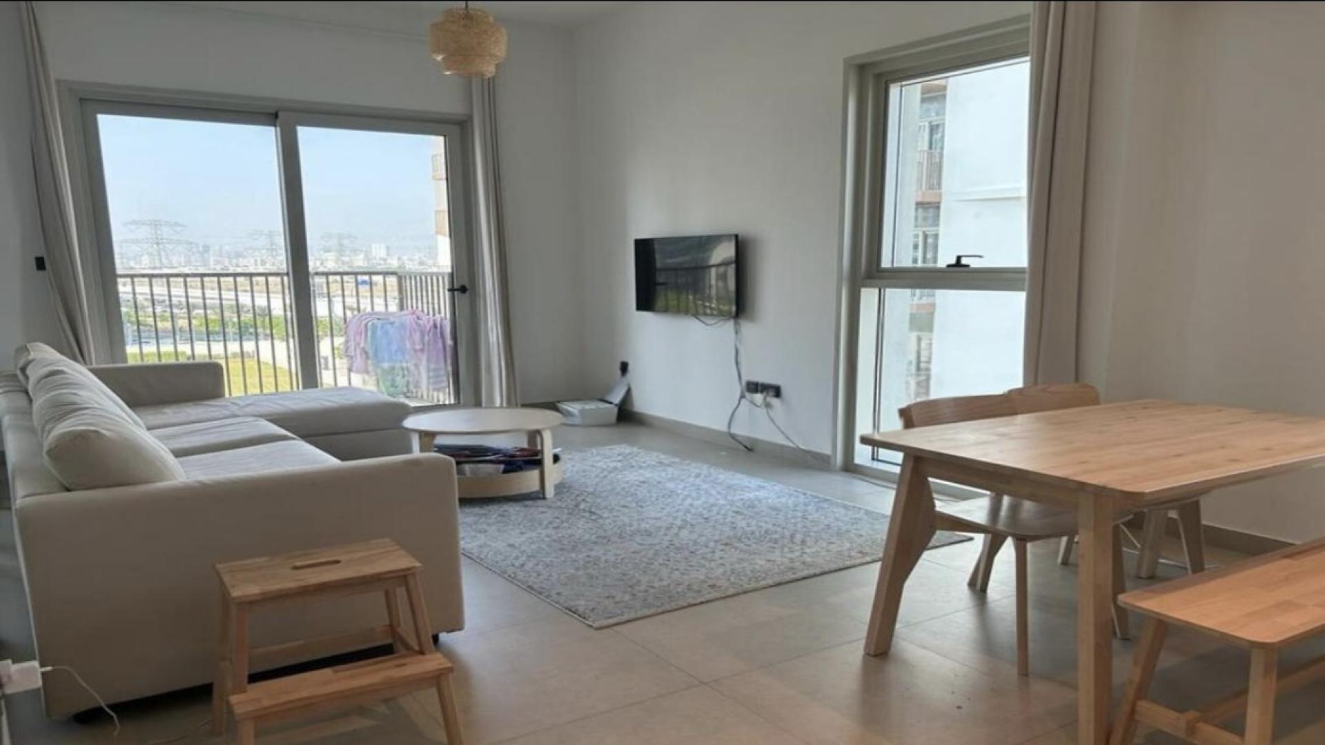 Modern kitchen and dining area in Dubai Hills Estate apartment, Collective 2.0 Tower A