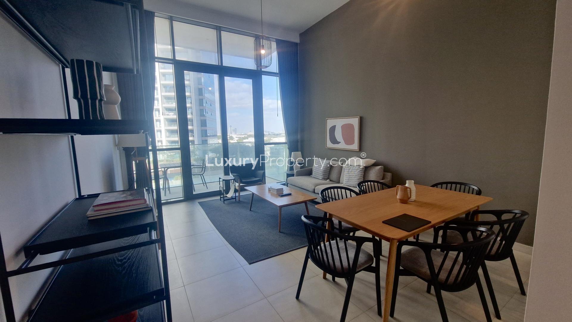 Modern bedroom in Downtown Views apartment for rent, featuring stylish decor and ample storage