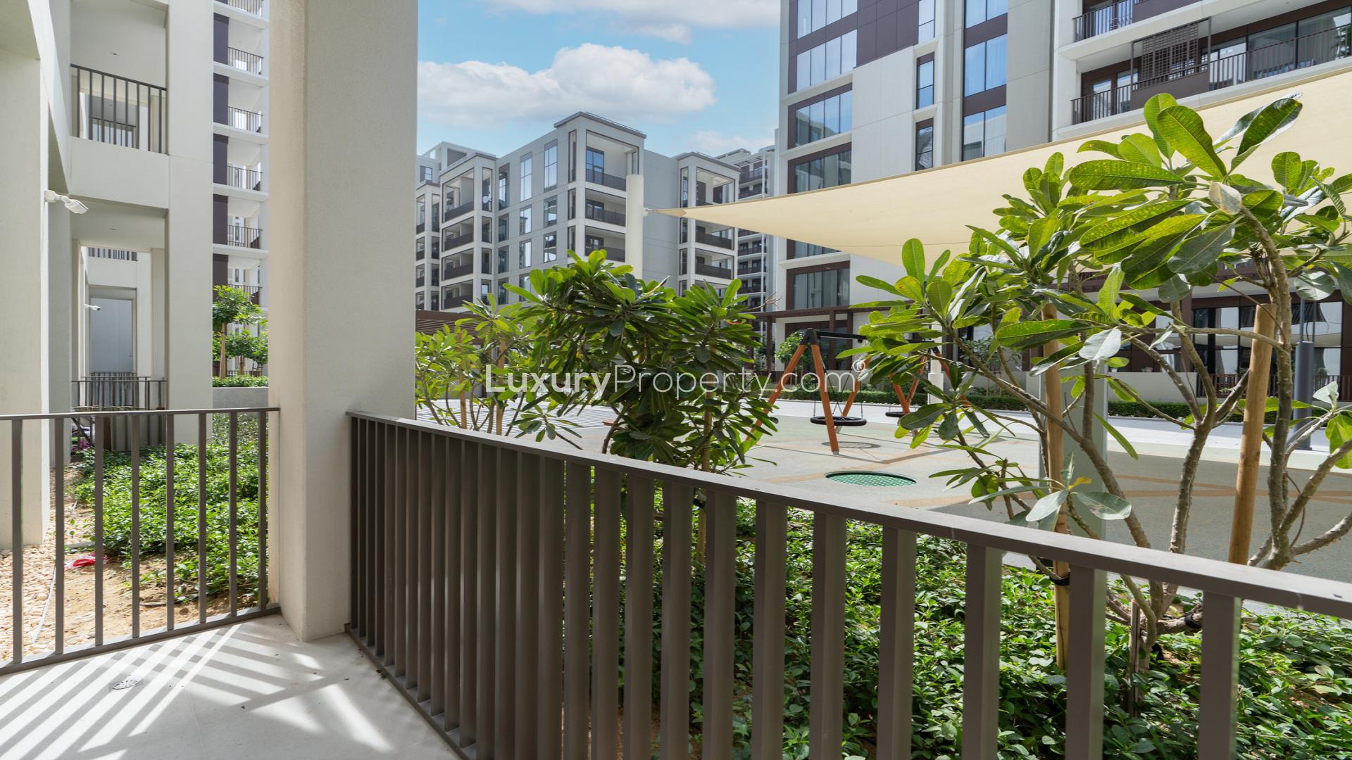 Empty living room with large windows in Cedar, Creek Beach apartment for rent