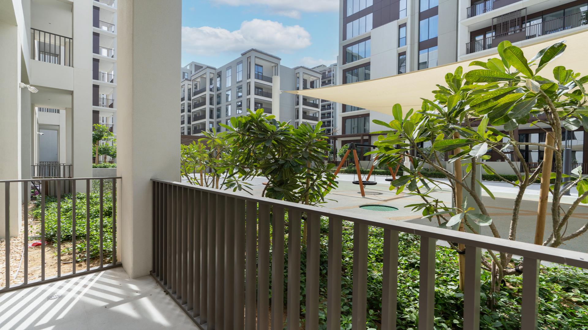 Empty living room with large windows in Cedar, Creek Beach apartment for rent