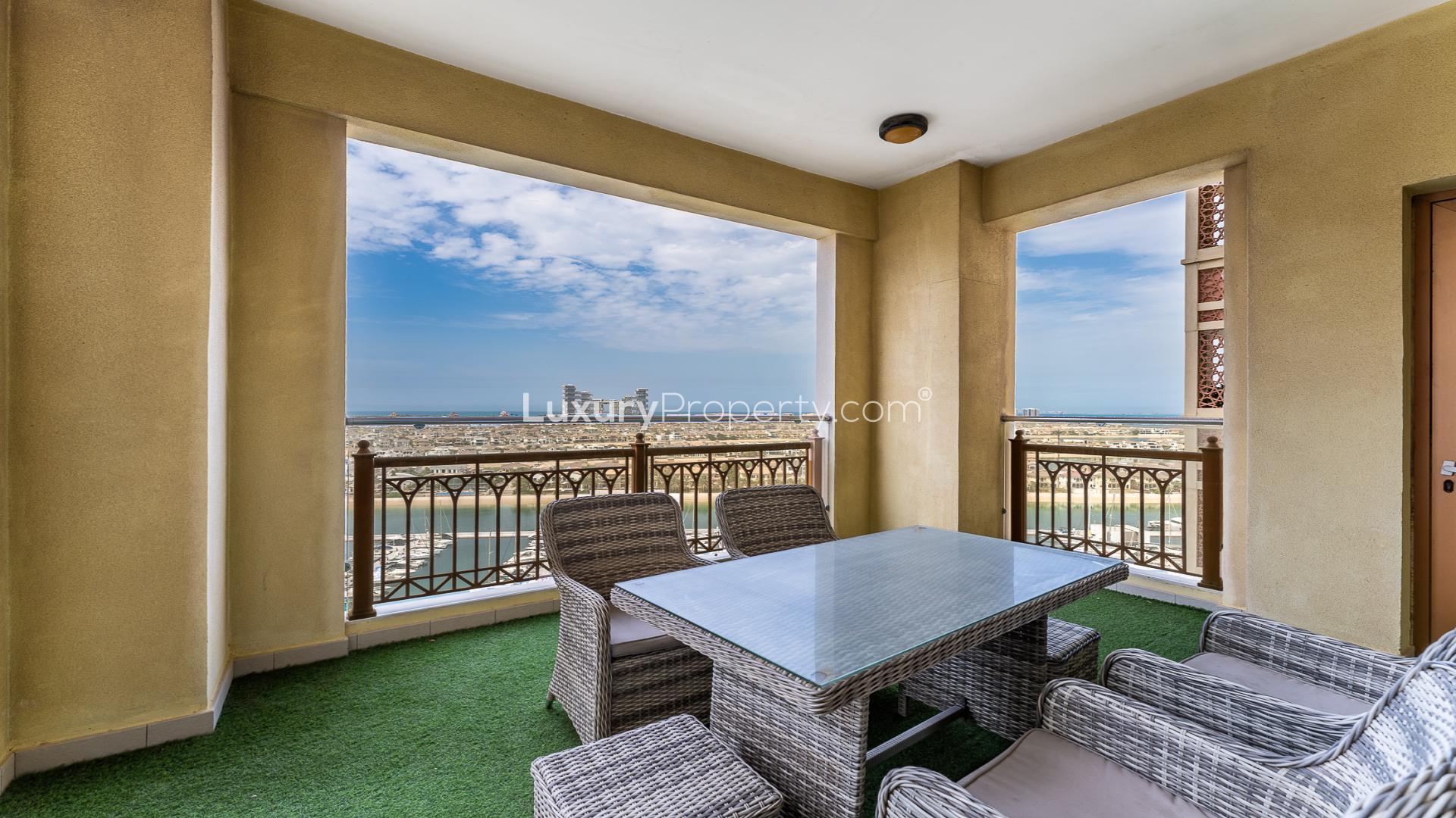 Modern kitchen in Marina Residences 6 apartment, Palm Jumeirah, with wood cabinets and appliances