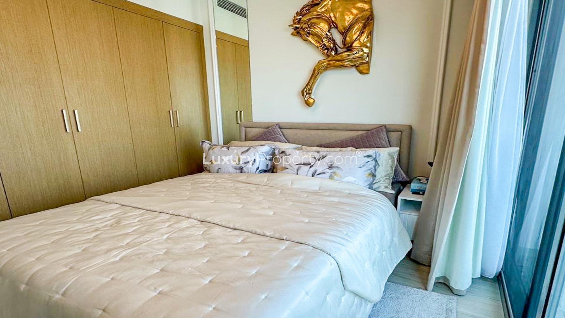 Bedroom in Fawad Azizi Residence, Al Jaddaf apartment, featuring modern decor and ample storage