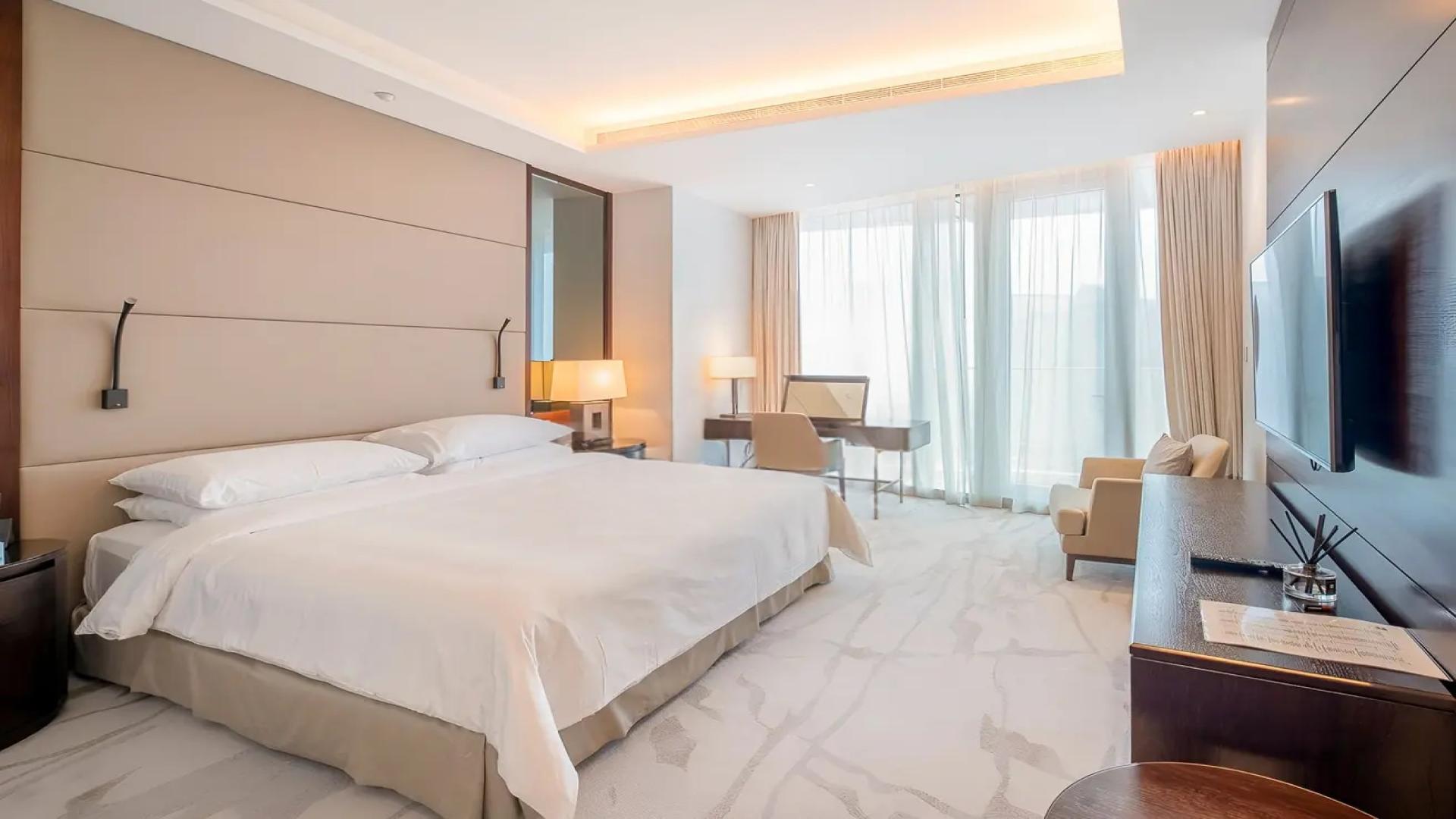 Modern living room in Vida Downtown Residence, Dubai apartment, featuring chic furniture and decor