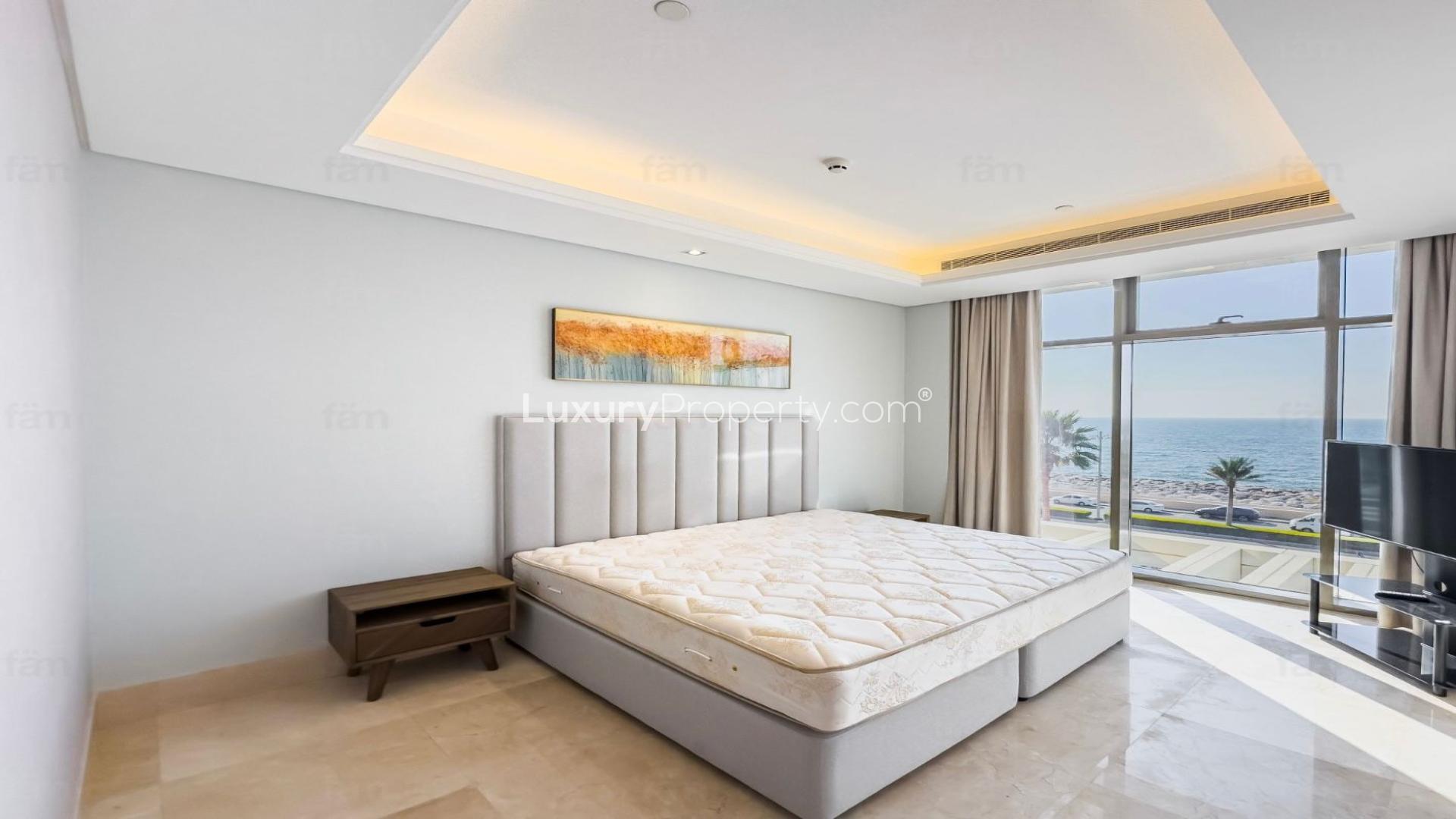 Modern living room in Palm Jumeirah apartment with sleek kitchen and stylish decor