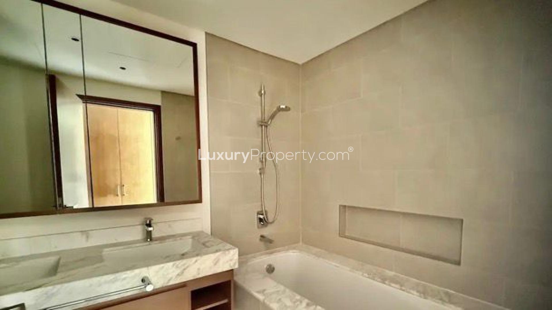 Bright bedroom with built-in wardrobe and balcony view in Creek Rise Tower 2 apartment