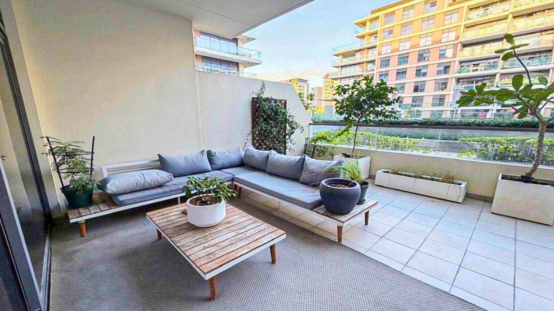 Spacious open-plan living area in Mulberry 2 apartment, Dubai Hill Estate, available for rent