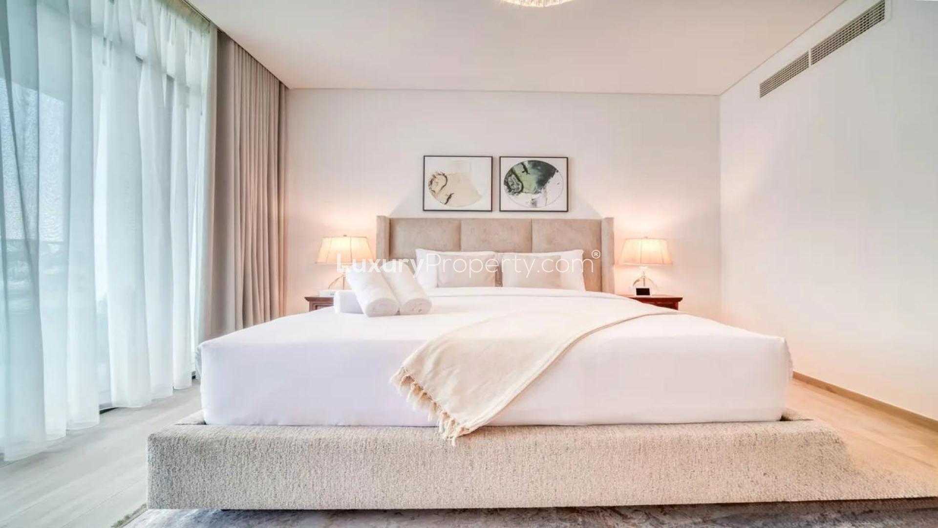 "Modern dining area with elegant decor in Dubai Creek Harbour apartment for rent.",Luxurious furnished bedroom in Address Harbour Point, Dubai Creek Harbour apartment for rent