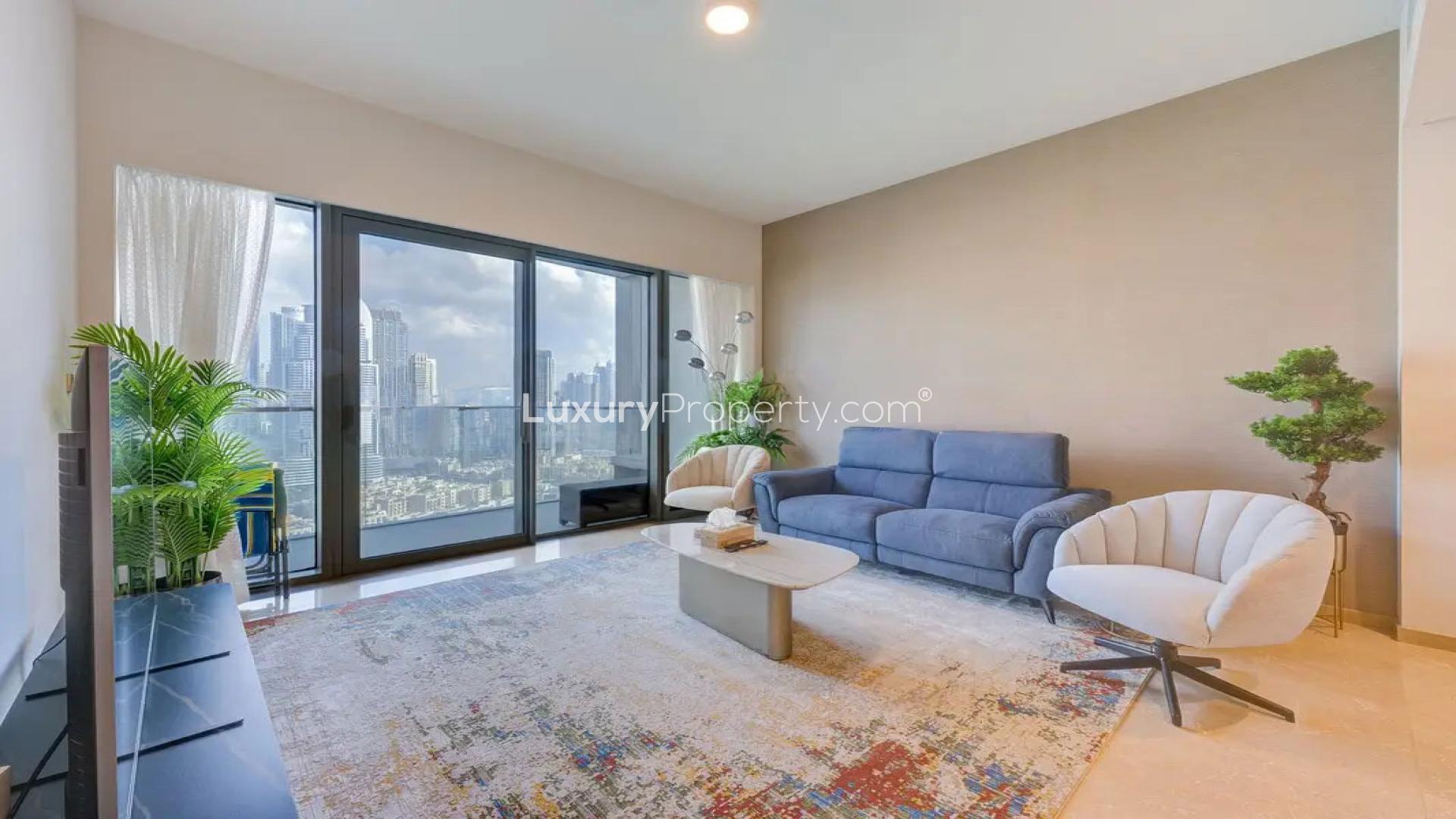 Modern living room in Dubai Creek Harbour apartment with city view, stylish furniture, and decor