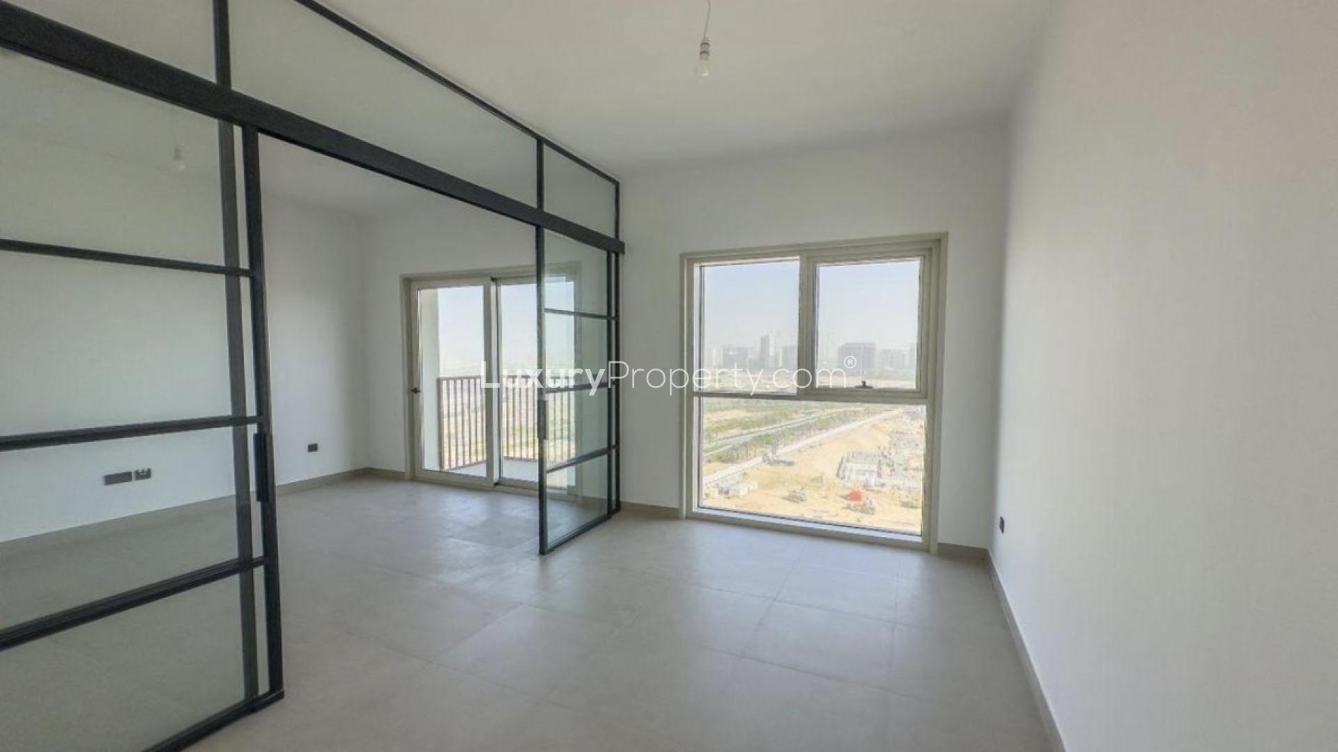 Modern living room with large windows in Dubai Hills Estate apartment, Collective 2.0 Tower A