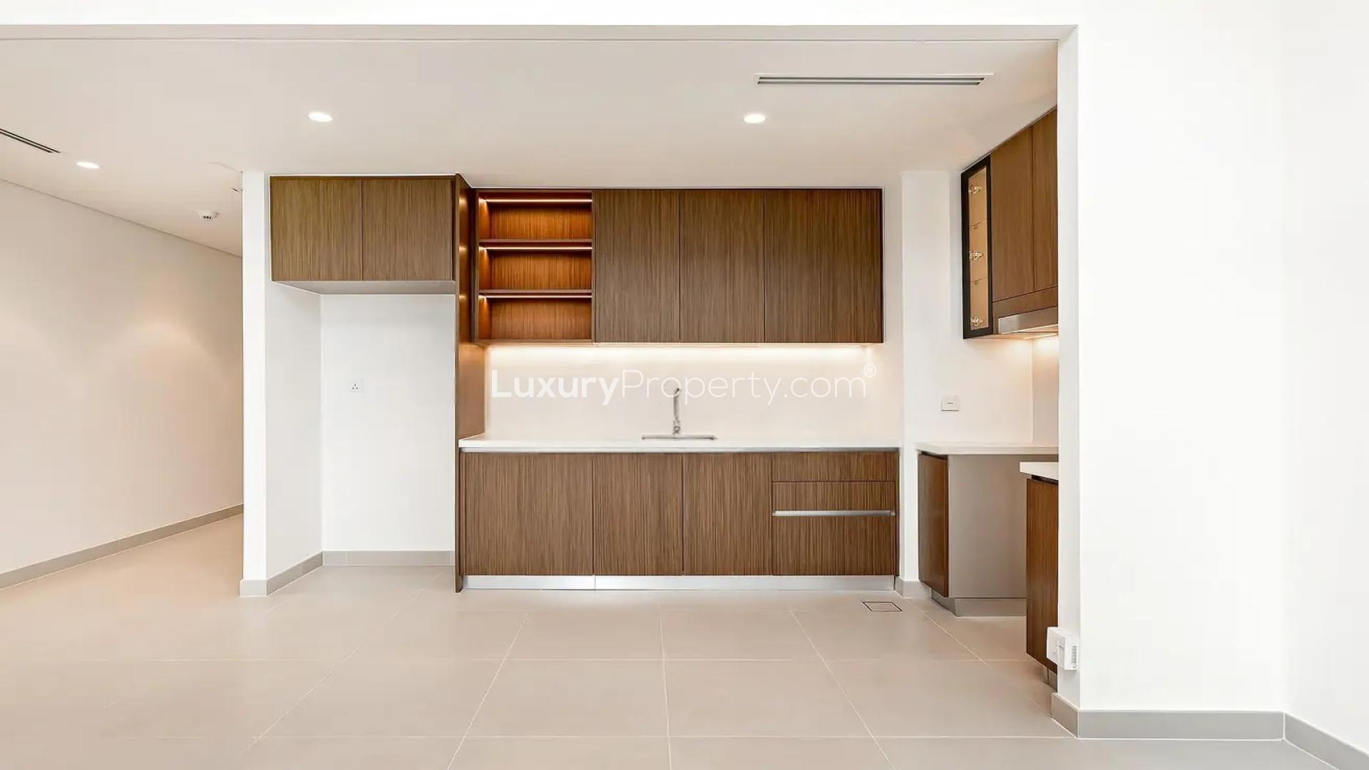 Modern open-plan kitchen and living area in Dubai Creek Harbour apartment for rent