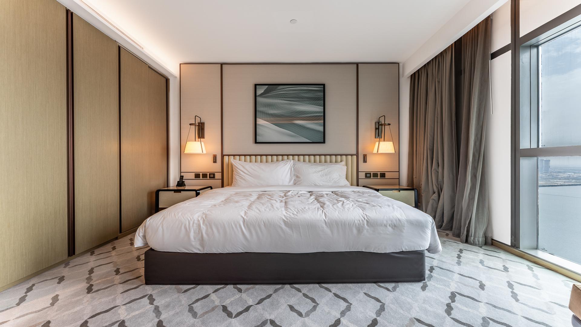 Luxurious living room in Dubai Creek Harbour apartment, modern furniture and large windows