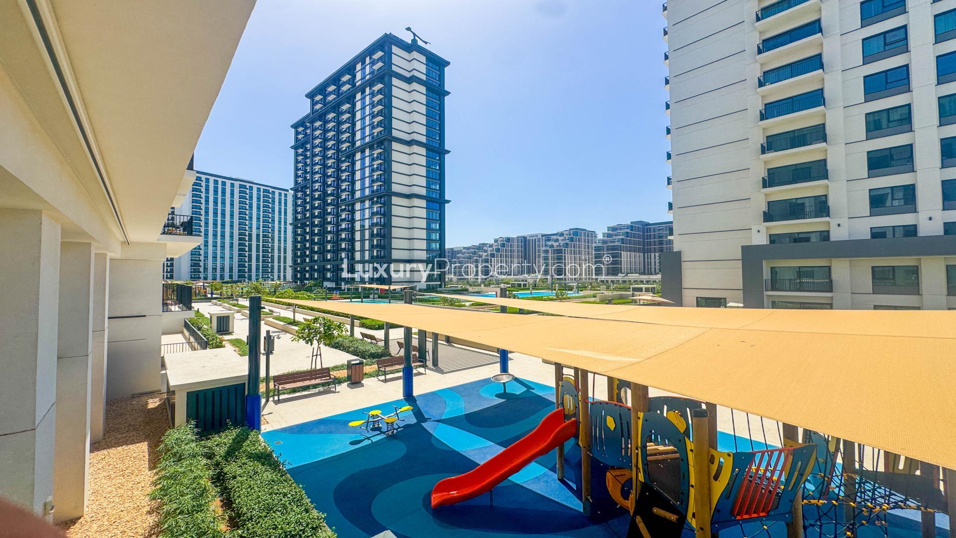 Corner apartment view of pool and amenities at Park Field Tower 1, Dubai Hill Estate