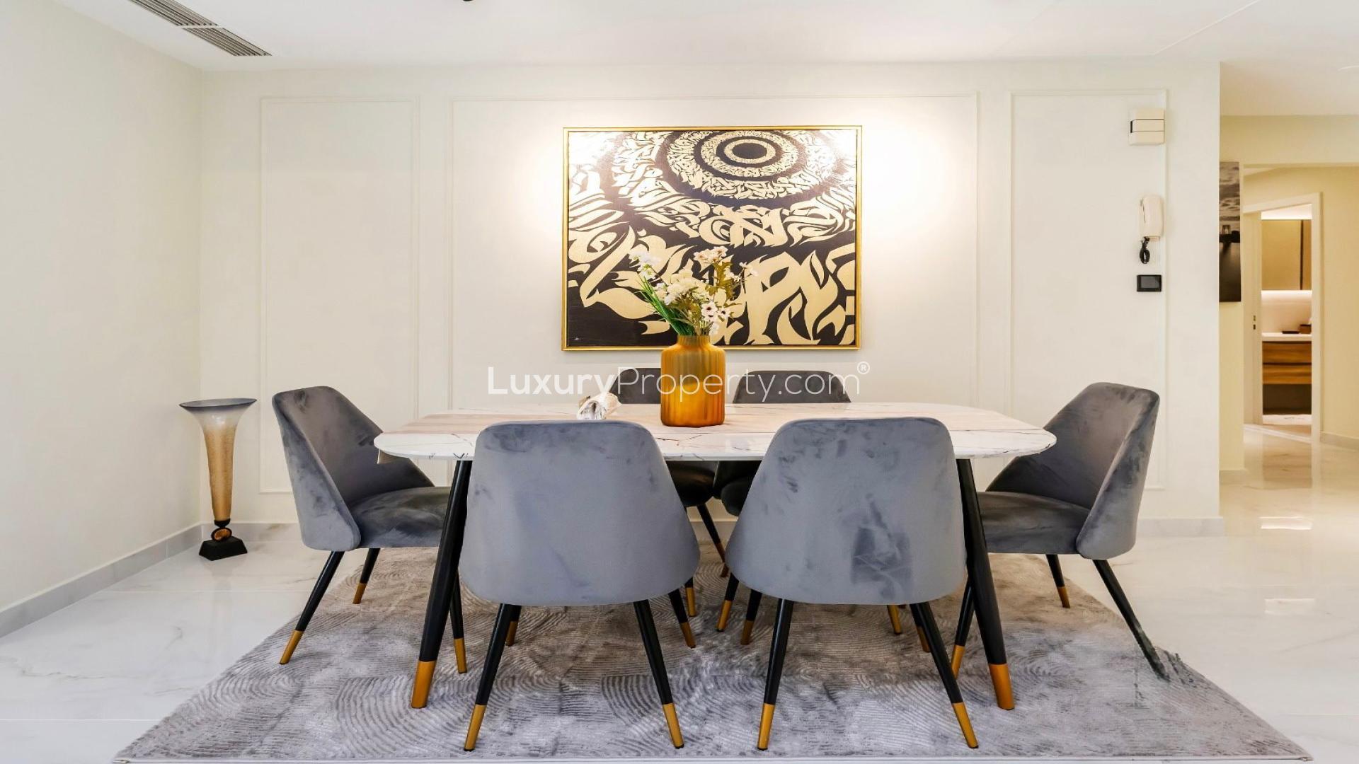 Jumeirah Beach Residence apartment view with marina, modern decor, and comfortable seating area