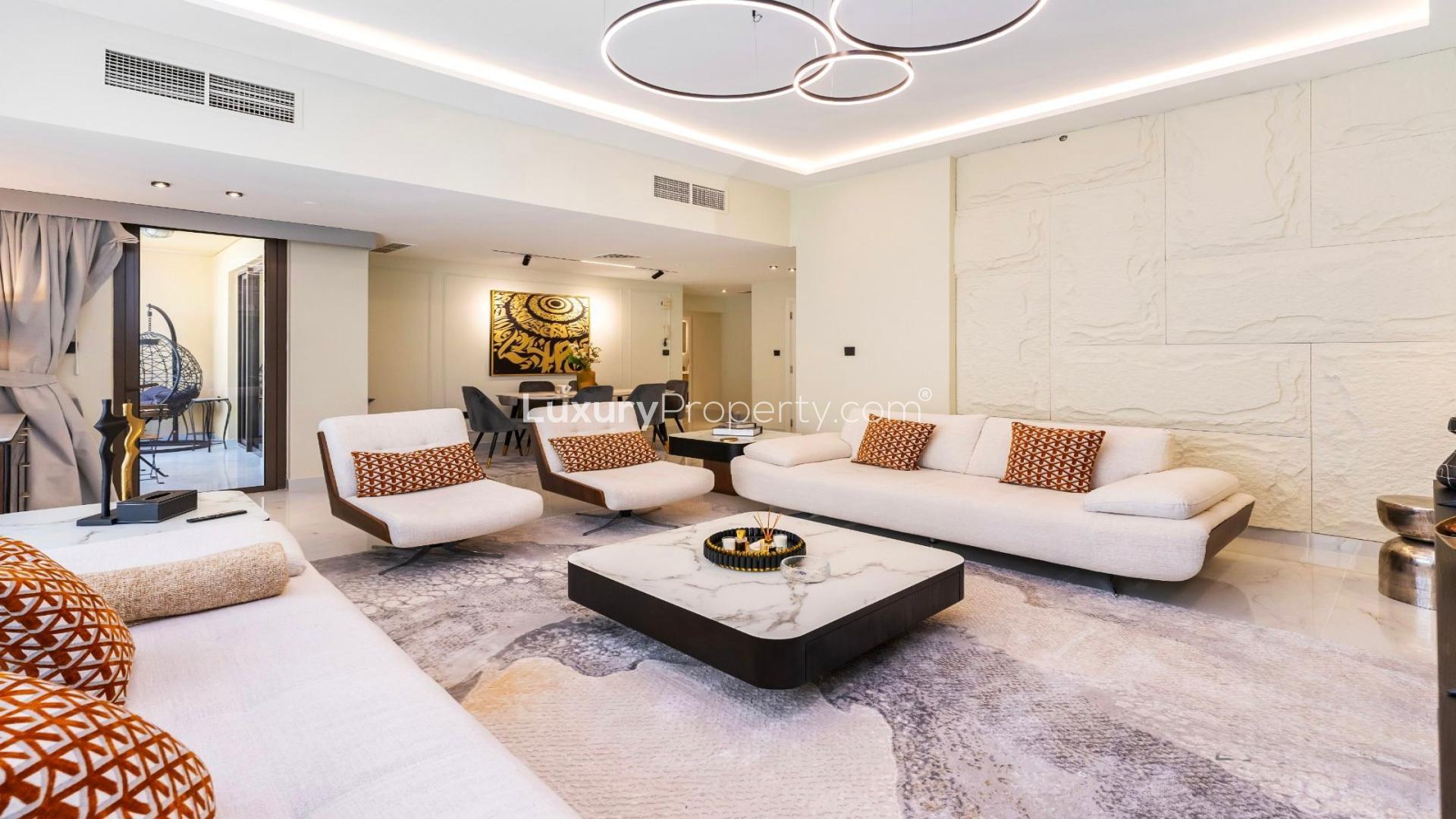 Modern living and dining area in JBR apartment for rent, featuring elegant decor