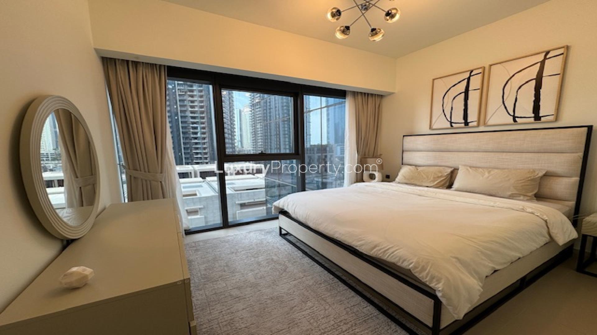 Modern bedroom in Act Towers apartment, Downtown, featuring large windows and stylish decor