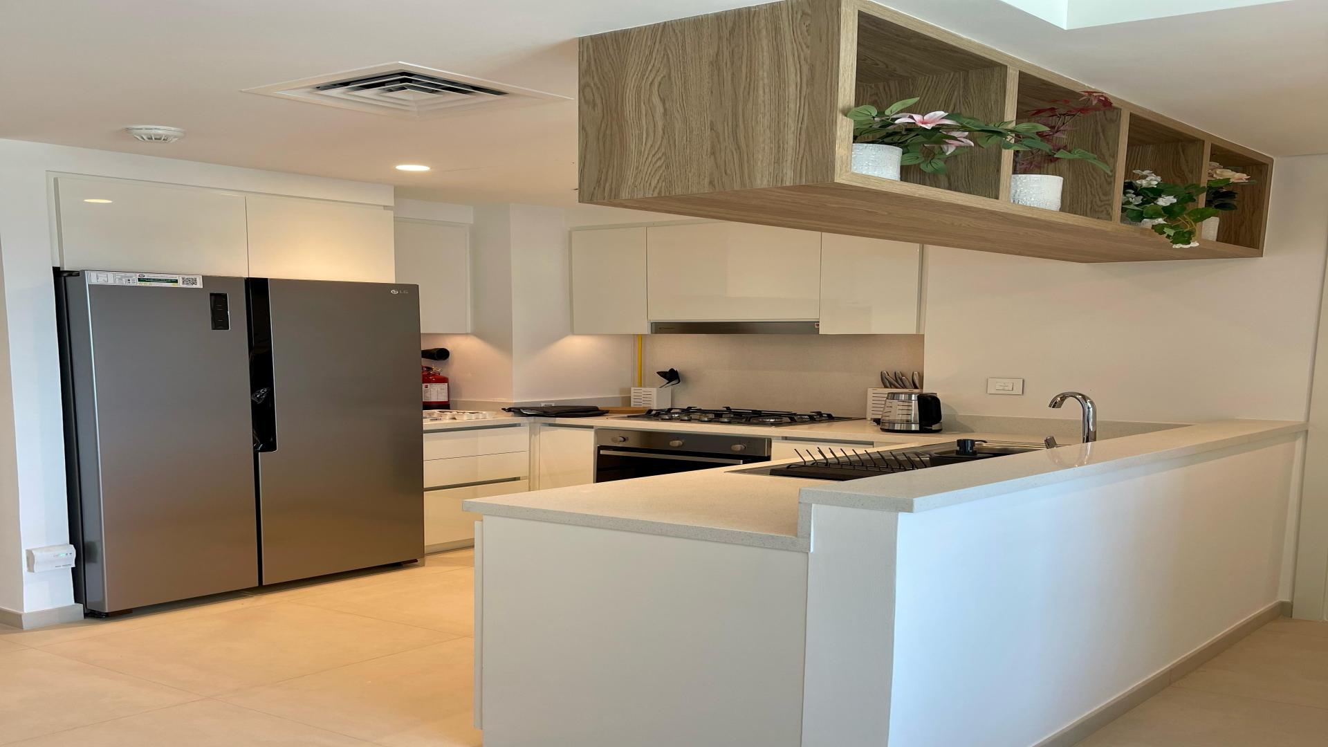 Modern living room and kitchen in Downtown Dubai apartment for rent, LP48951