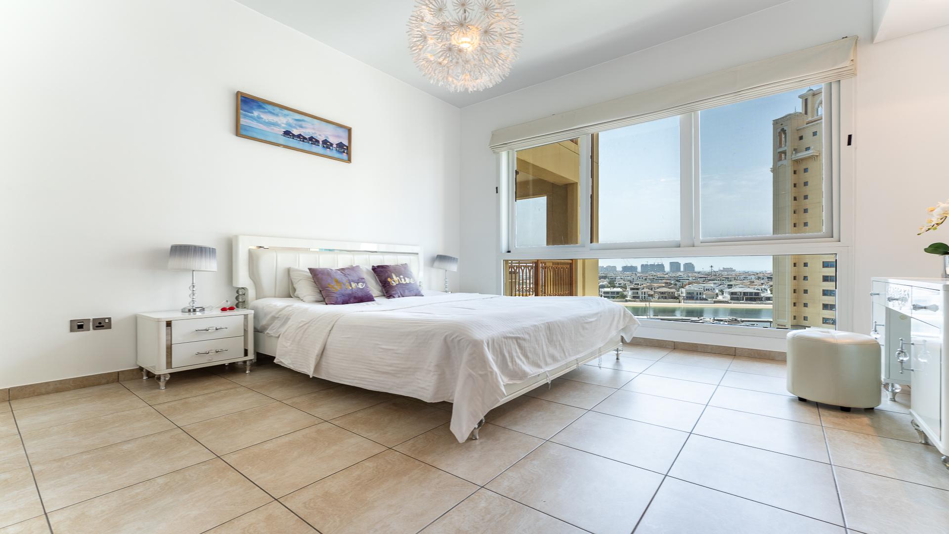 Furnished bedroom with large window view in Marina Residences 1, Palm Jumeirah apartment
