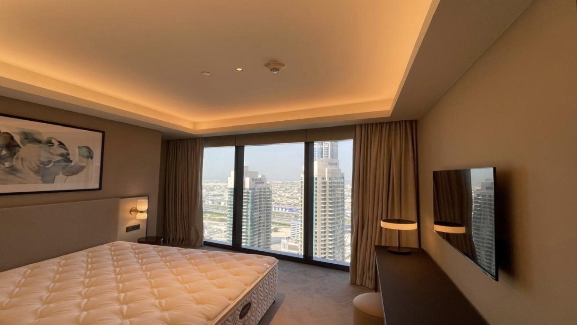 High-floor luxury apartment bedroom with city view in Address Opera Downtown, Dubai