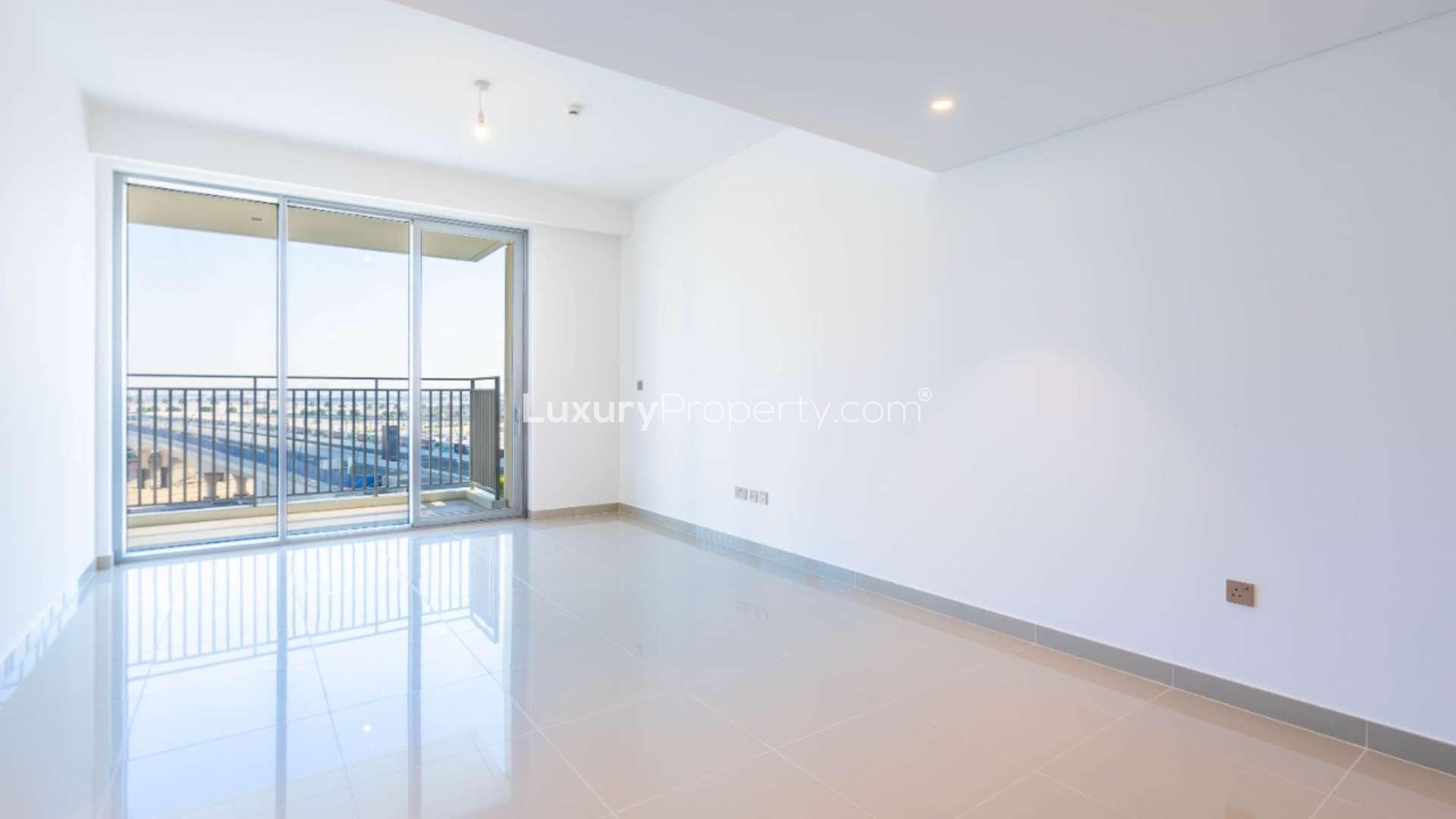 Empty room with large window view in 2-bedroom apartment, 17 Icon Bay, Dubai Creek Harbour
