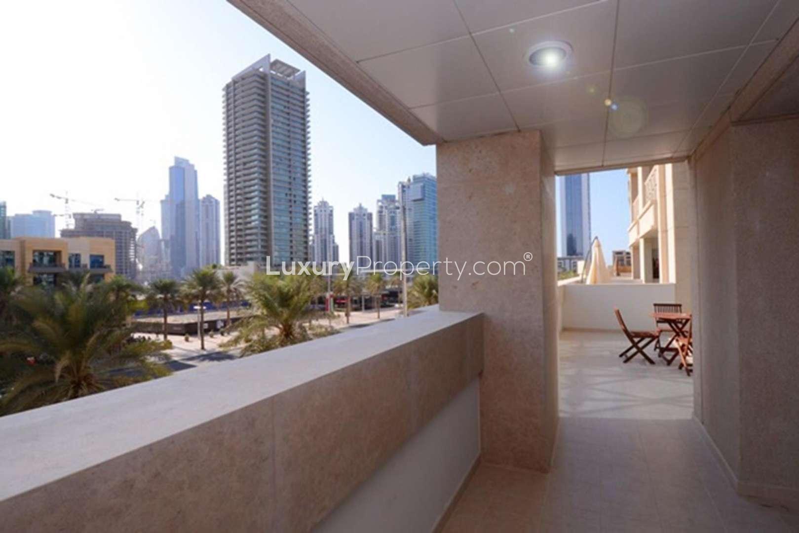 Modern living room in 2-bedroom apartment, 29 Boulevard, Downtown Dubai, with open kitchen
