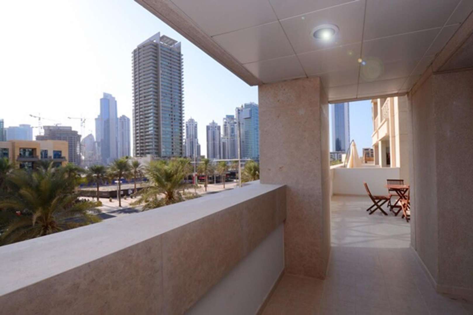 Modern living room in 2-bedroom apartment, 29 Boulevard, Downtown Dubai, with open kitchen