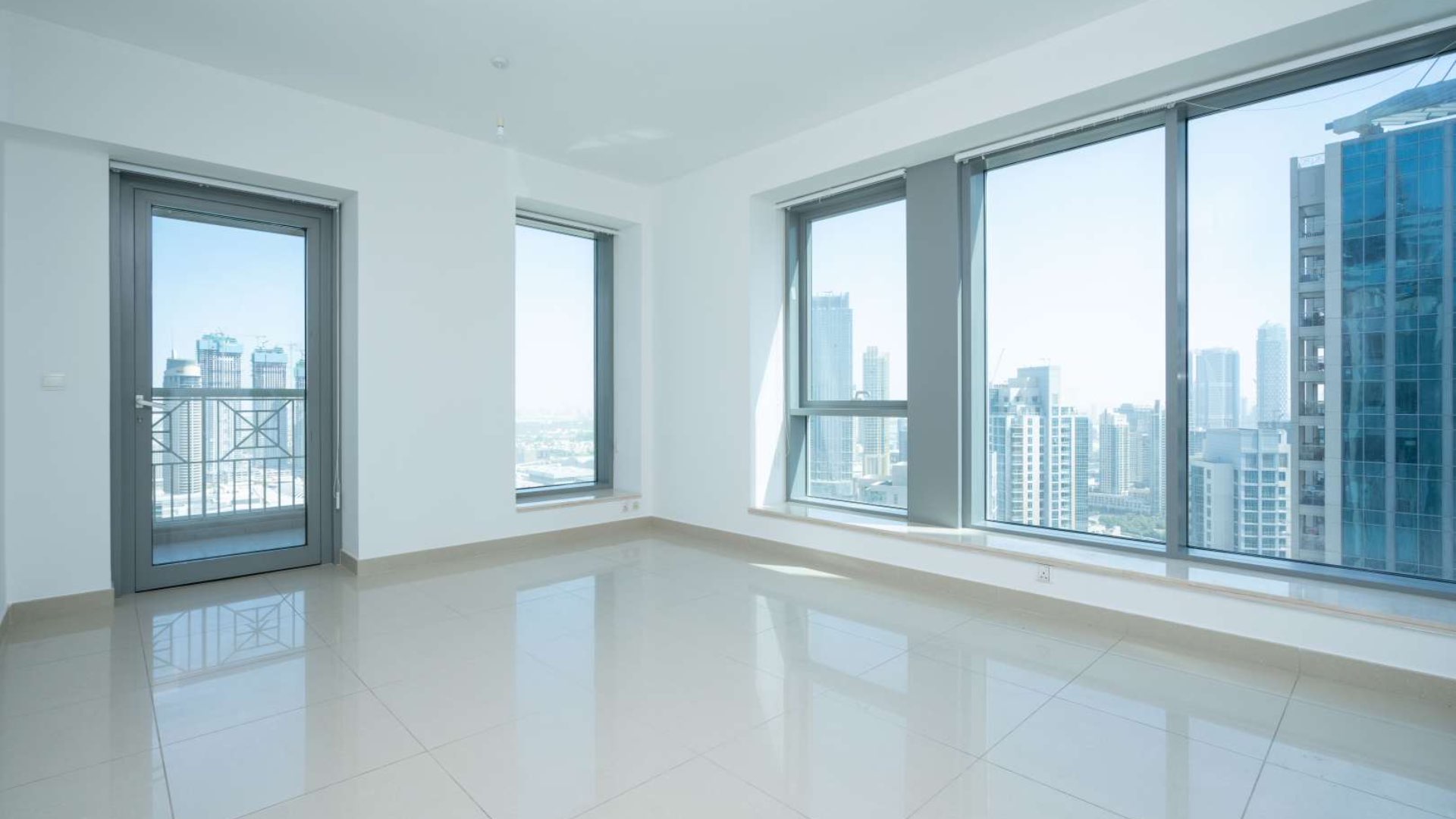 Bright living room with large windows in 2-bedroom apartment, Downtown Dubai skyline views