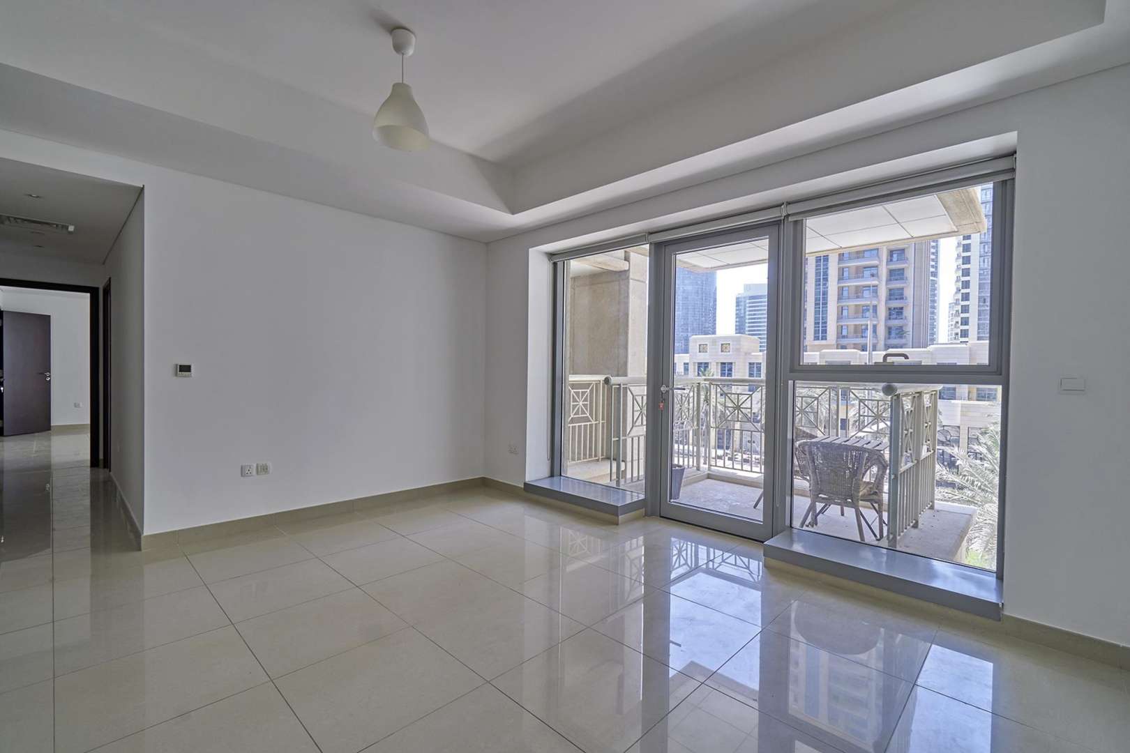 Bright living room with balcony view in Downtown Dubai apartment for rent