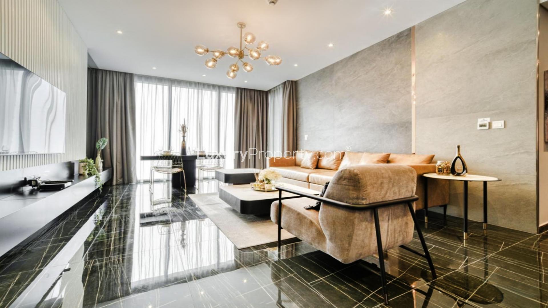 Luxurious furnished living room in 2-bedroom Dubai Marina apartment with modern decor and sea views