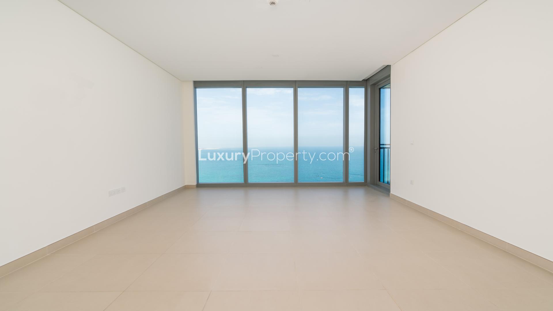 "Stunning sea view from luxury apartment balcony in 5242 Tower, Dubai Marina.",Empty luxury apartment living room with ocean view in 5242 Tower 1, Dubai Marina
