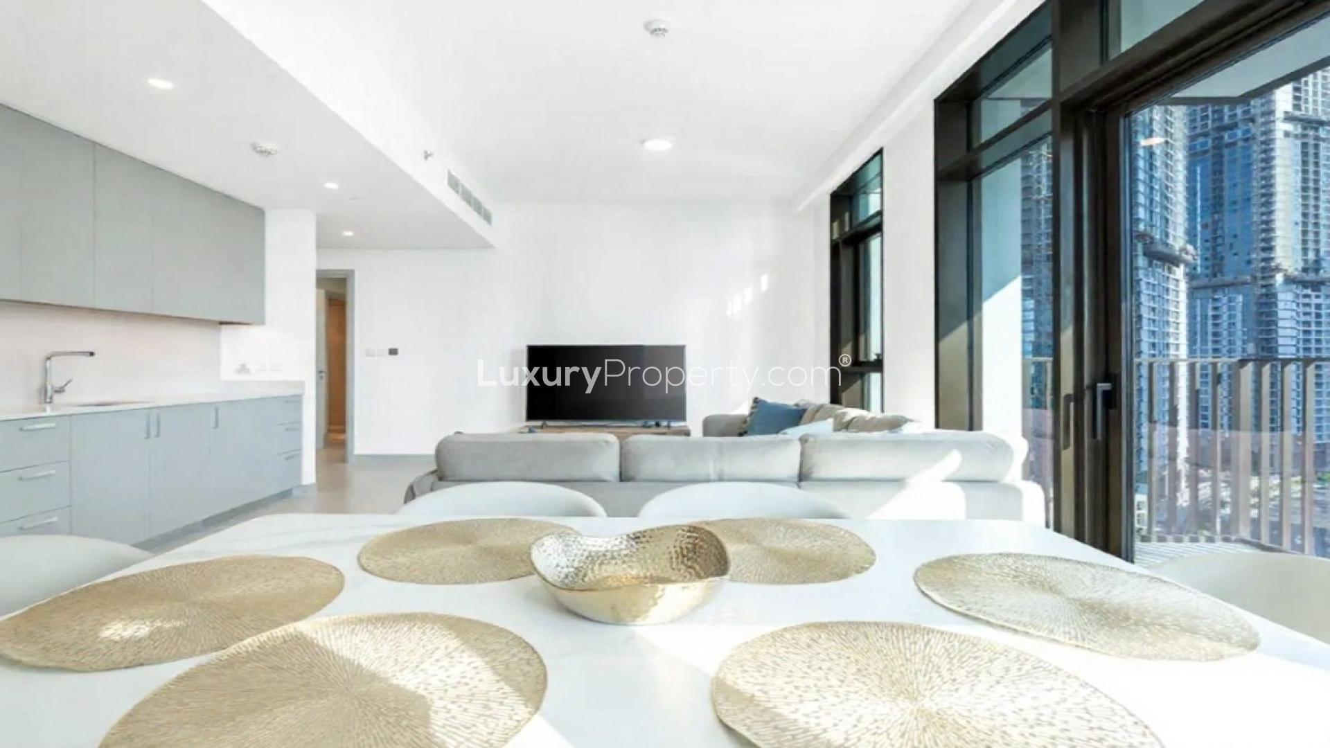 "Spacious living room with city views in Creek Crescent, Dubai Creek Harbour apartment.",Modern living room in fully furnished Dubai Creek Harbour apartment with city view