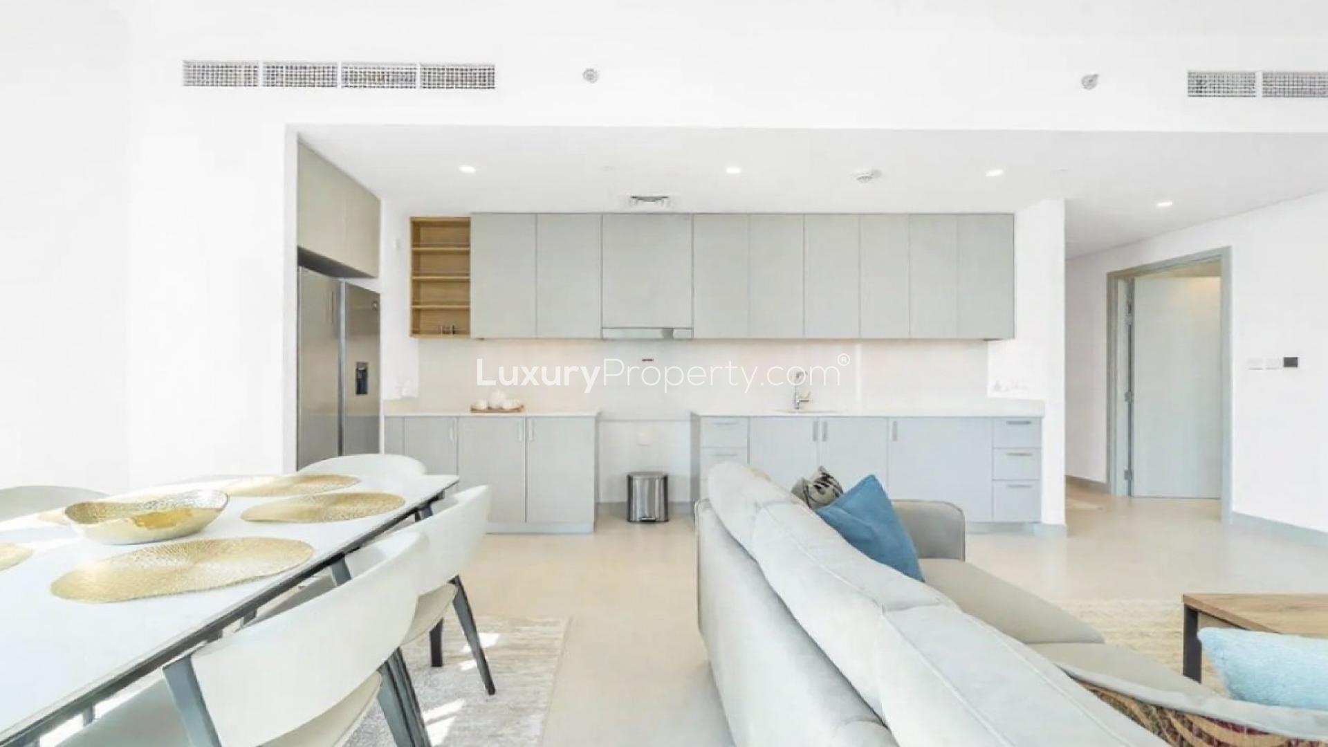 Modern kitchen and dining area in Creek Crescent apartment, Dubai Creek Harbour