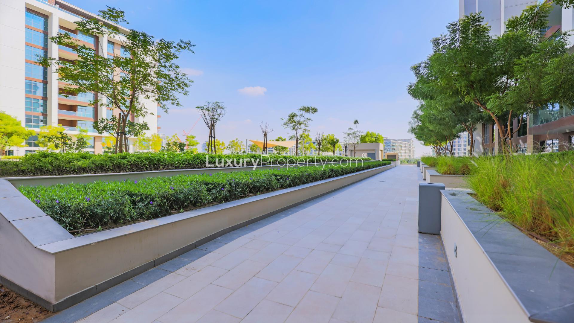 Empty living room with large windows in Dubai Hills Estate apartment for rent