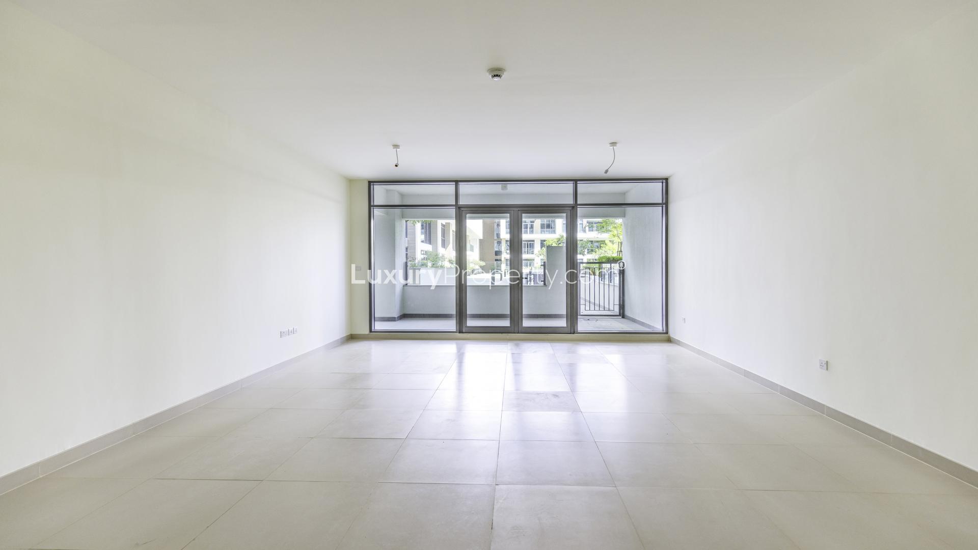 Spacious terrace with glass railing at Dubai Hills Estate apartment, Park Heights community