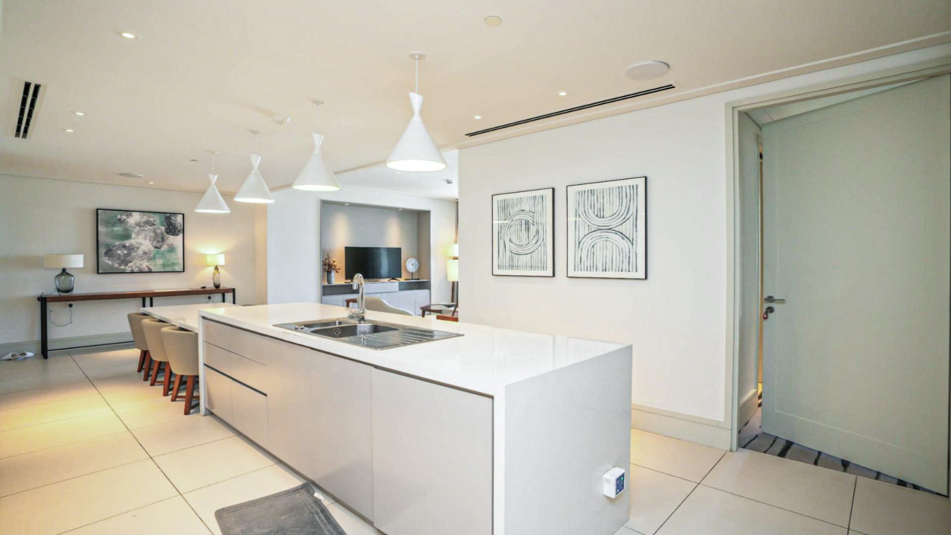 "Downtown Dubai apartment view with Burj Khalifa and fountain, Vida Residence skyline scenery.",Fully furnished modern kitchen and dining area in Vida Residence Downtown Dubai apartment