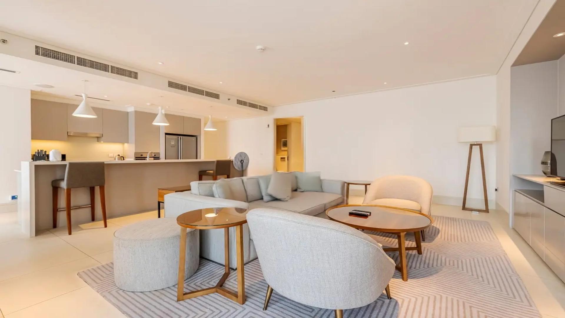 Modern living room in Vida Downtown Residence, Dubai apartment, featuring chic furniture and decor
