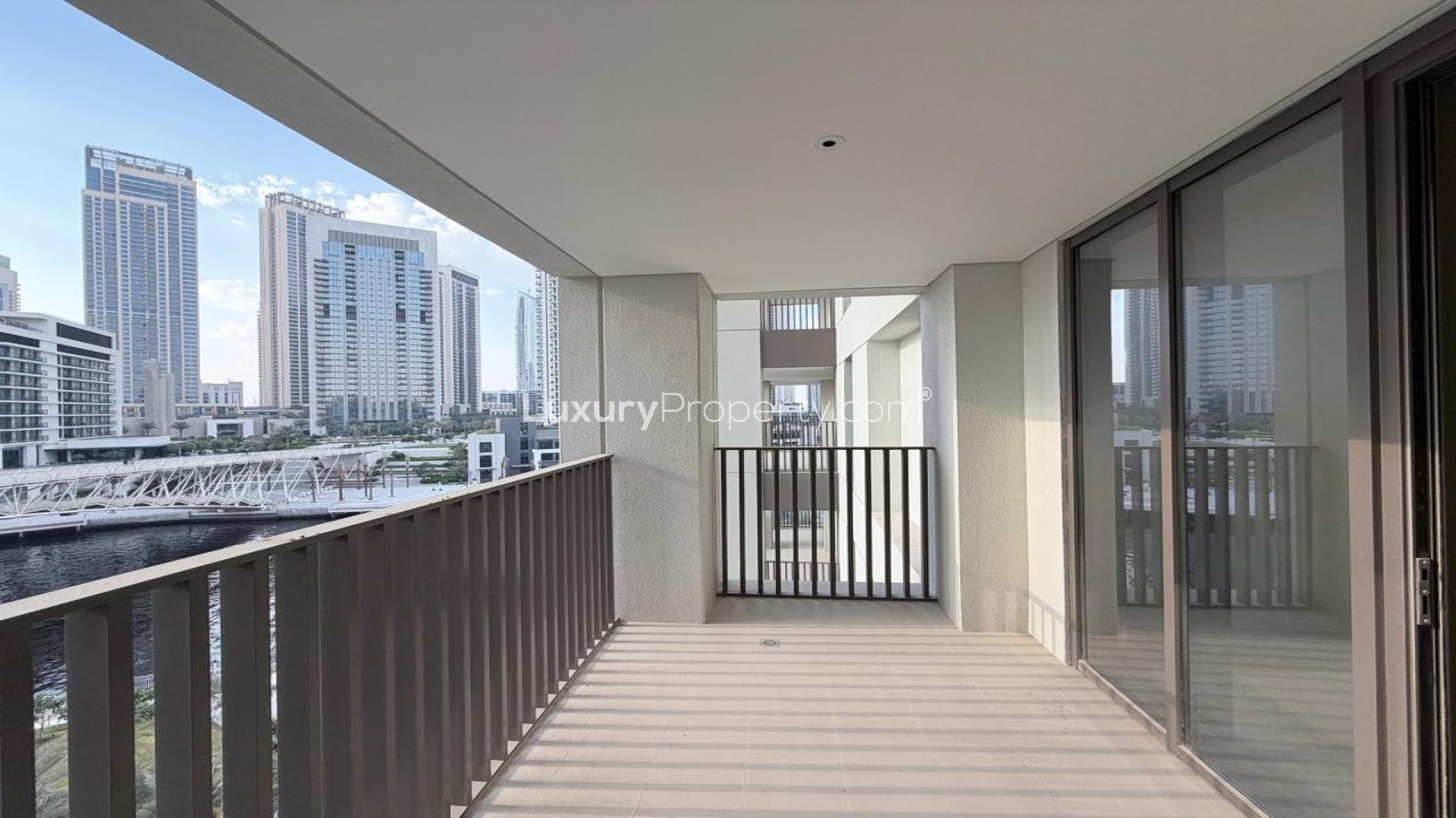 "Modern apartment view in Dubai Creek Harbour, Grove at Creek Beach, overlooking water and skyline.",Balcony view of apartment for rent in Grove at Creek Beach, Dubai Creek Harbour