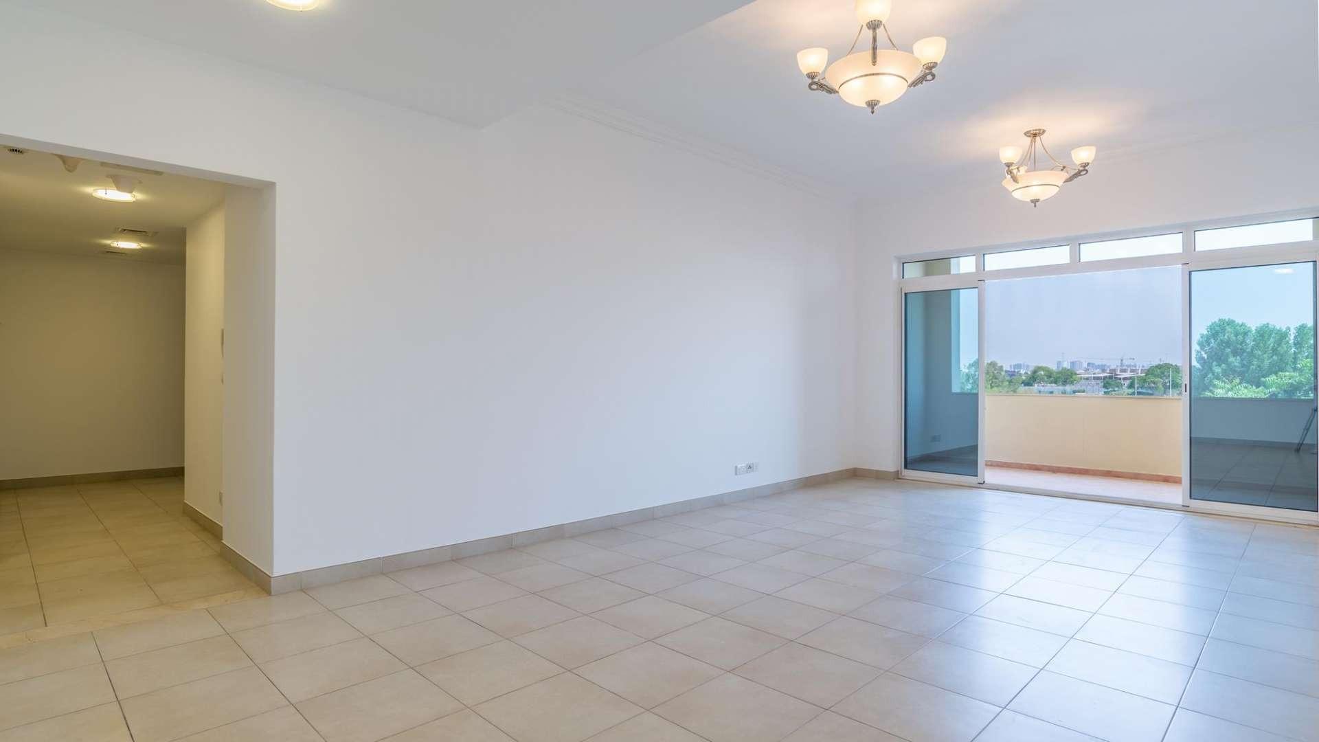 Spacious living room with balcony view in Al Badia Residences, Dubai Festival City