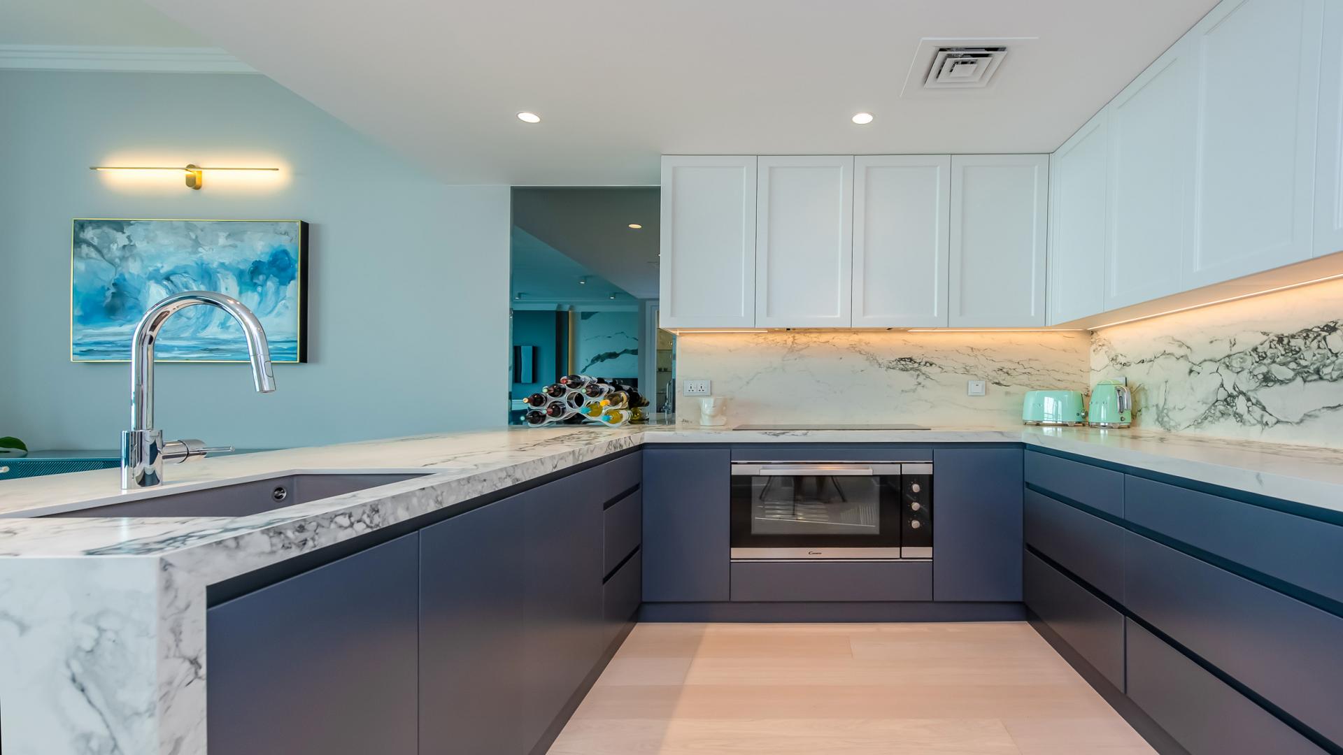 Furnished high-floor apartment interior with modern kitchen, dining area, and elegant decor in Jumeirah