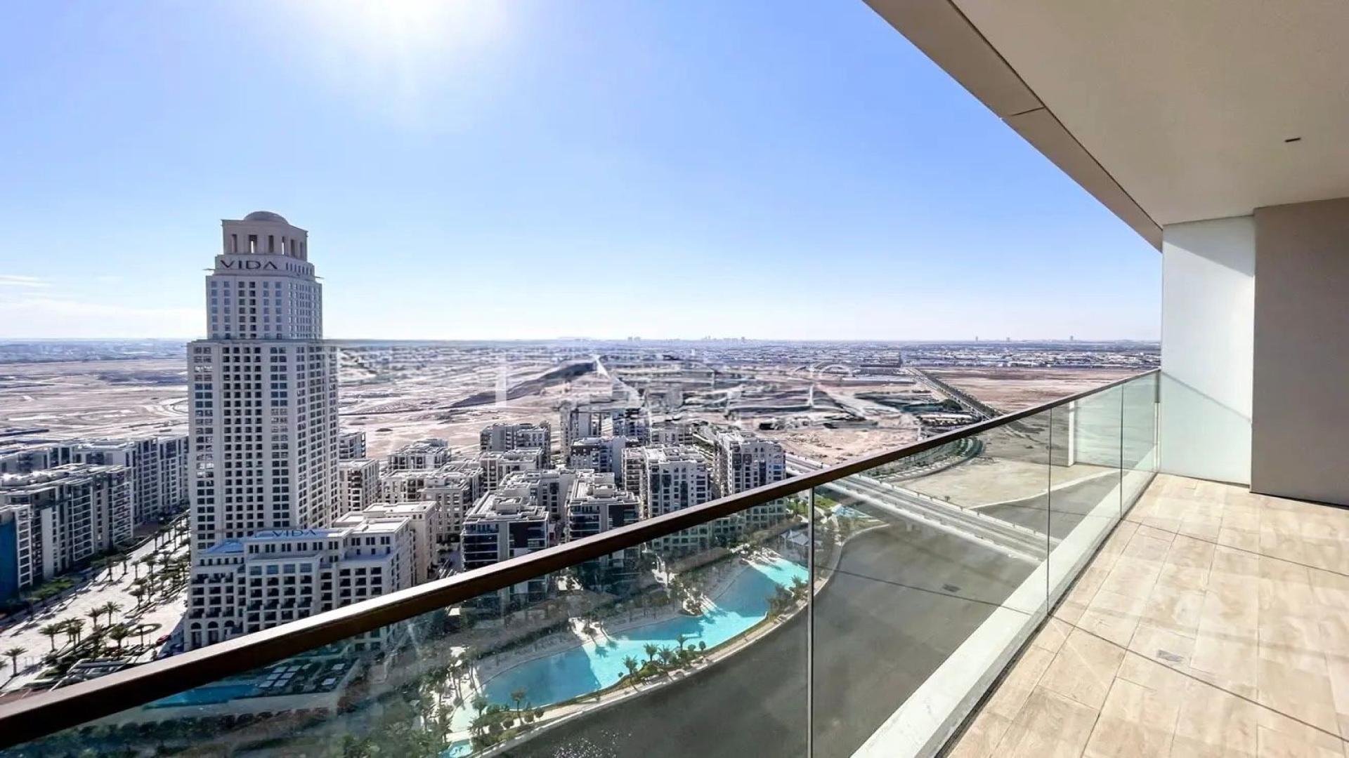 Modern high-floor apartment kitchen with large windows in Dubai Creek Harbour, Palace Residences